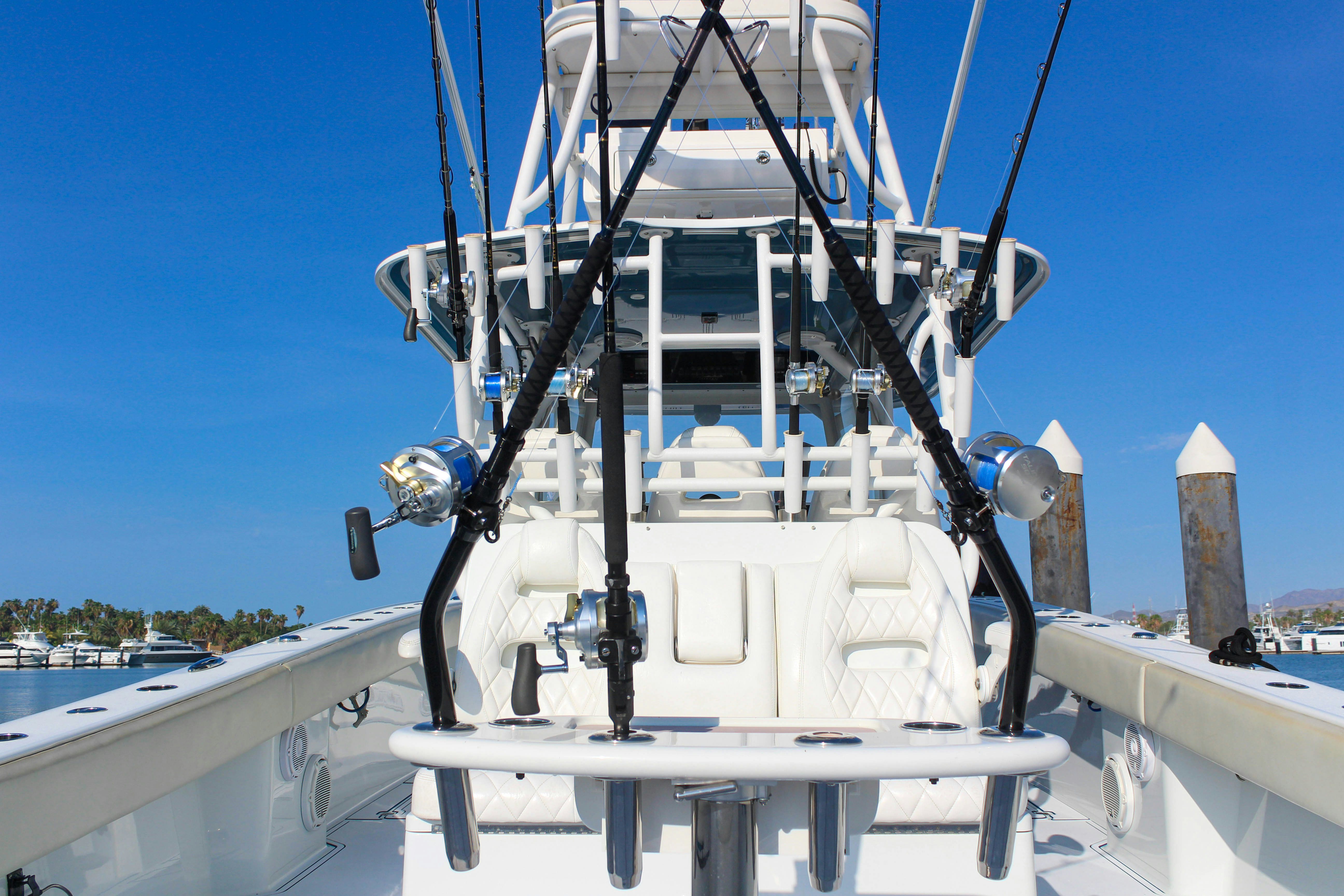 a large white boat on a dock aboard LET'S GO Yacht for Sale