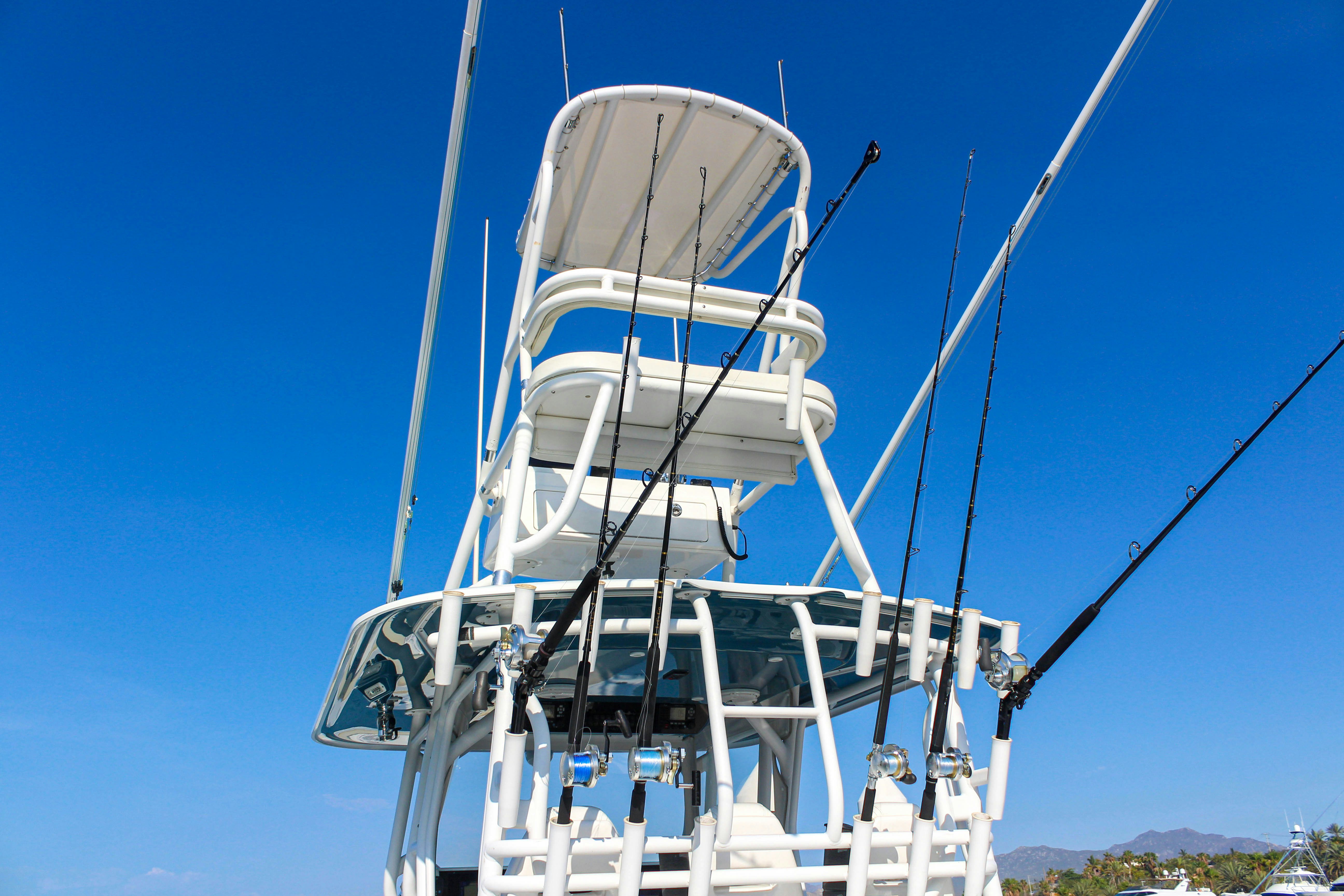 a large white boat on a body of water aboard LET'S GO Yacht for Sale