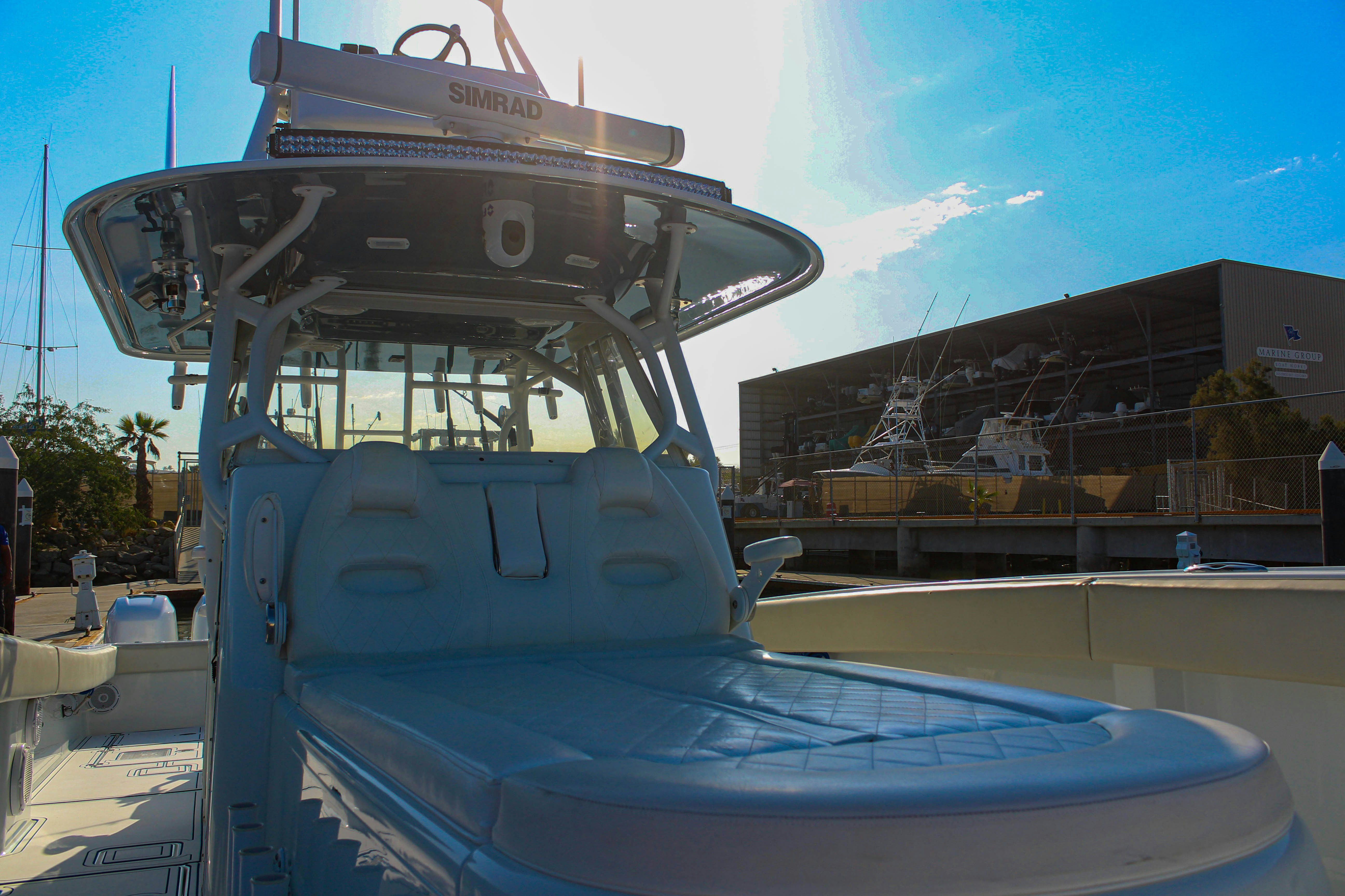 a large boat in a harbor aboard LET'S GO Yacht for Sale