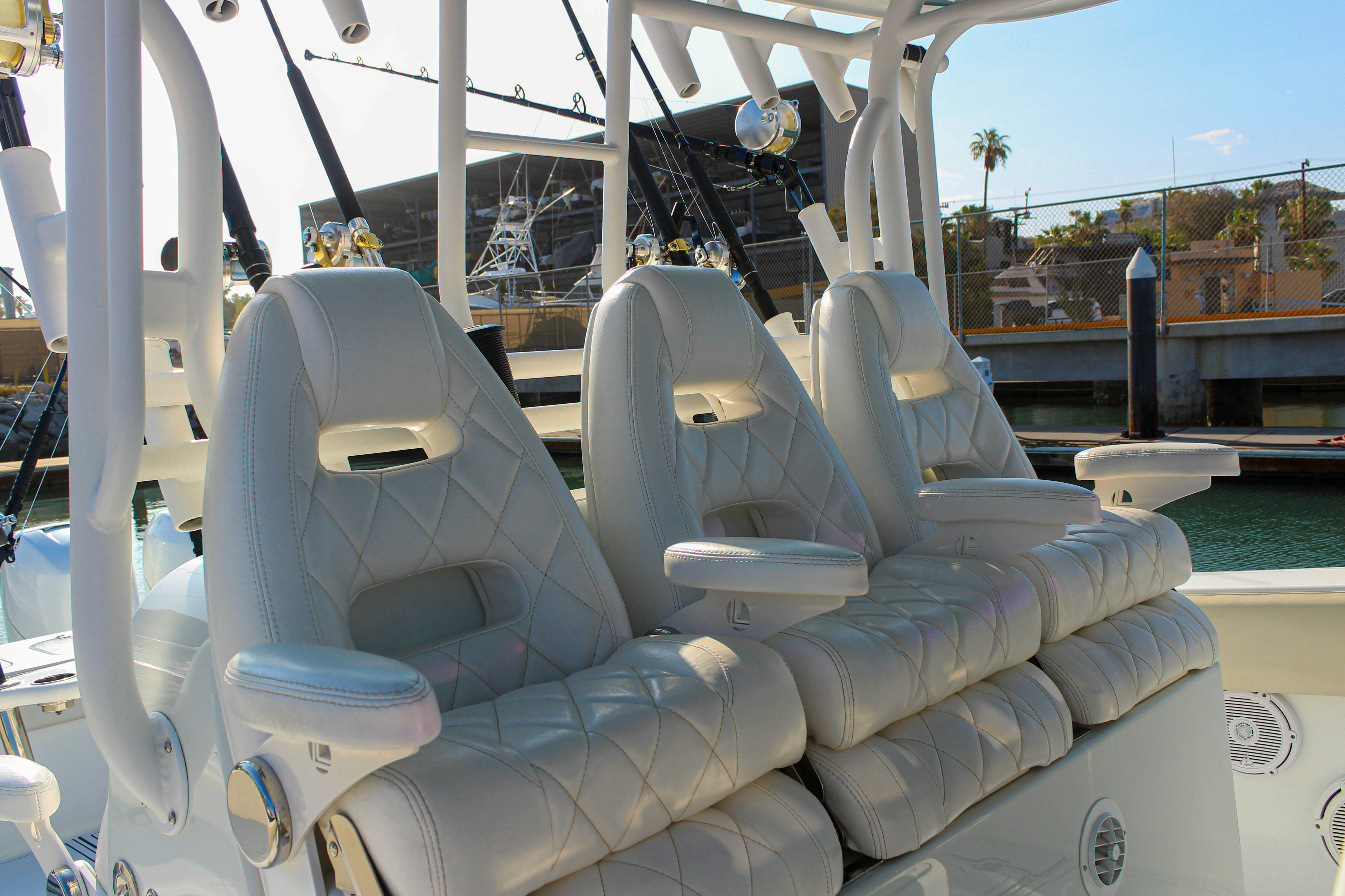 a large white boat on a deck aboard LET'S GO Yacht for Sale