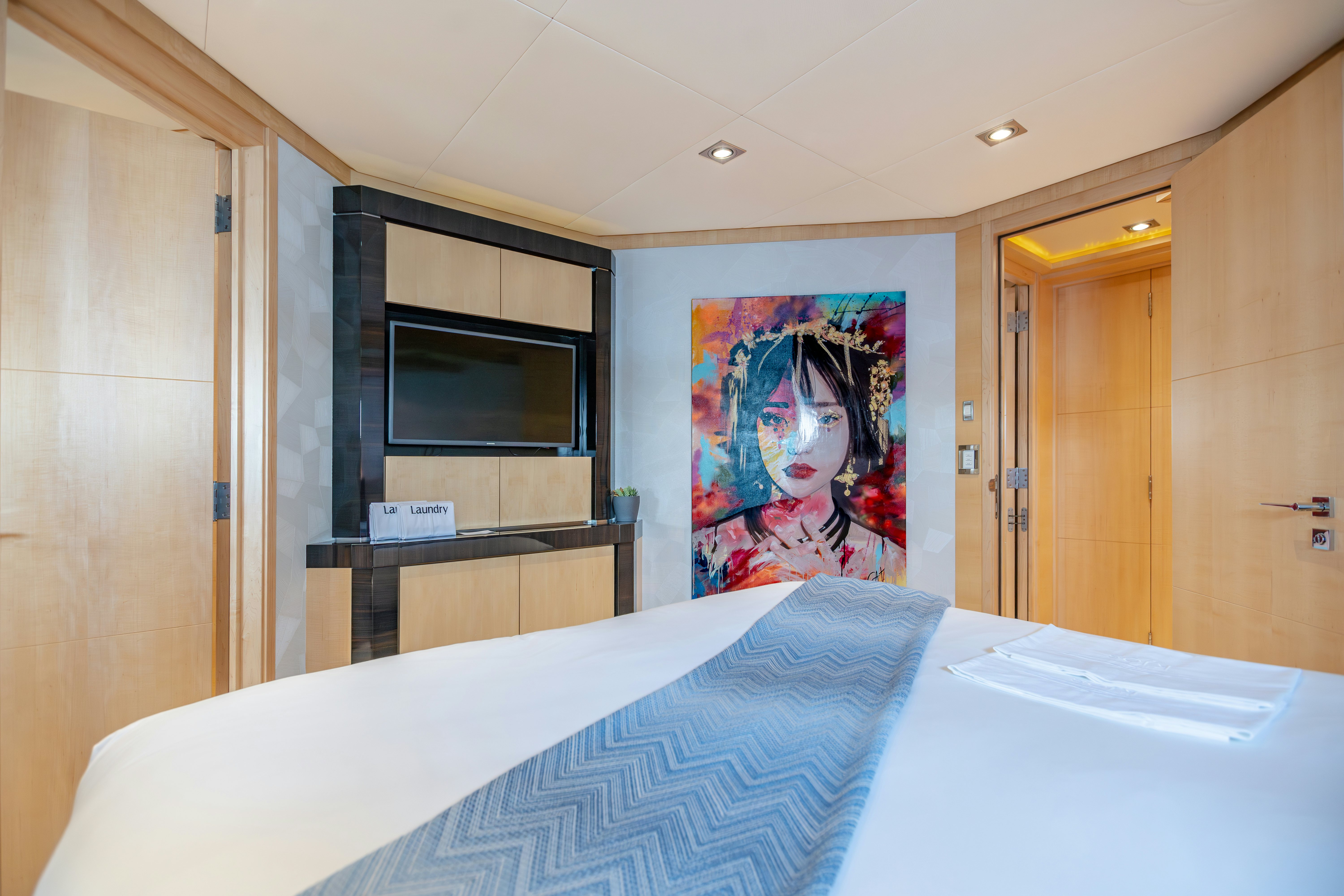 a bed in a room aboard KJOS Yacht for Sale