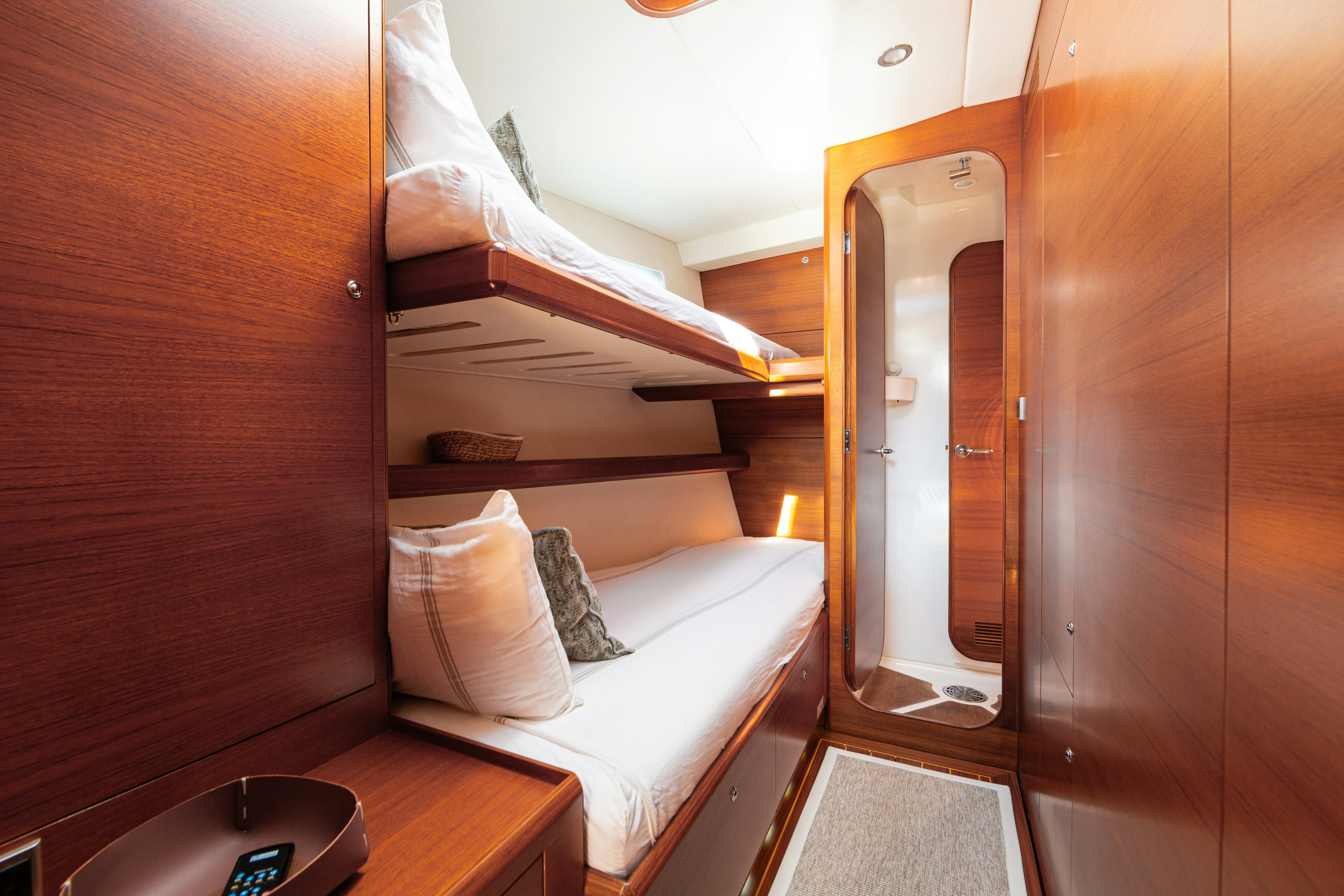 a room with a bed and a closet aboard FRIDA Yacht for Sale