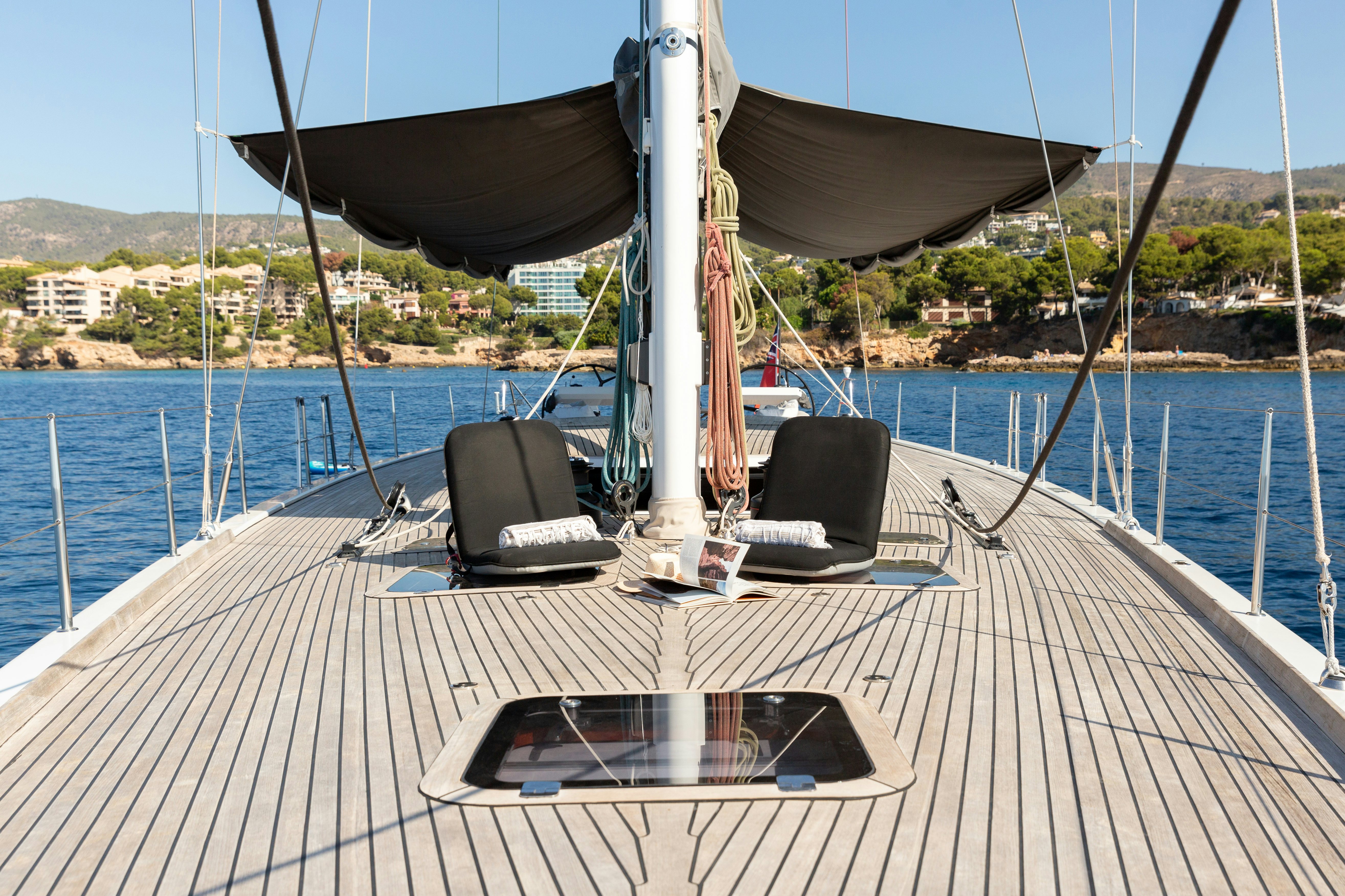 a deck with a chair and a chair on it aboard FRIDA Yacht for Sale