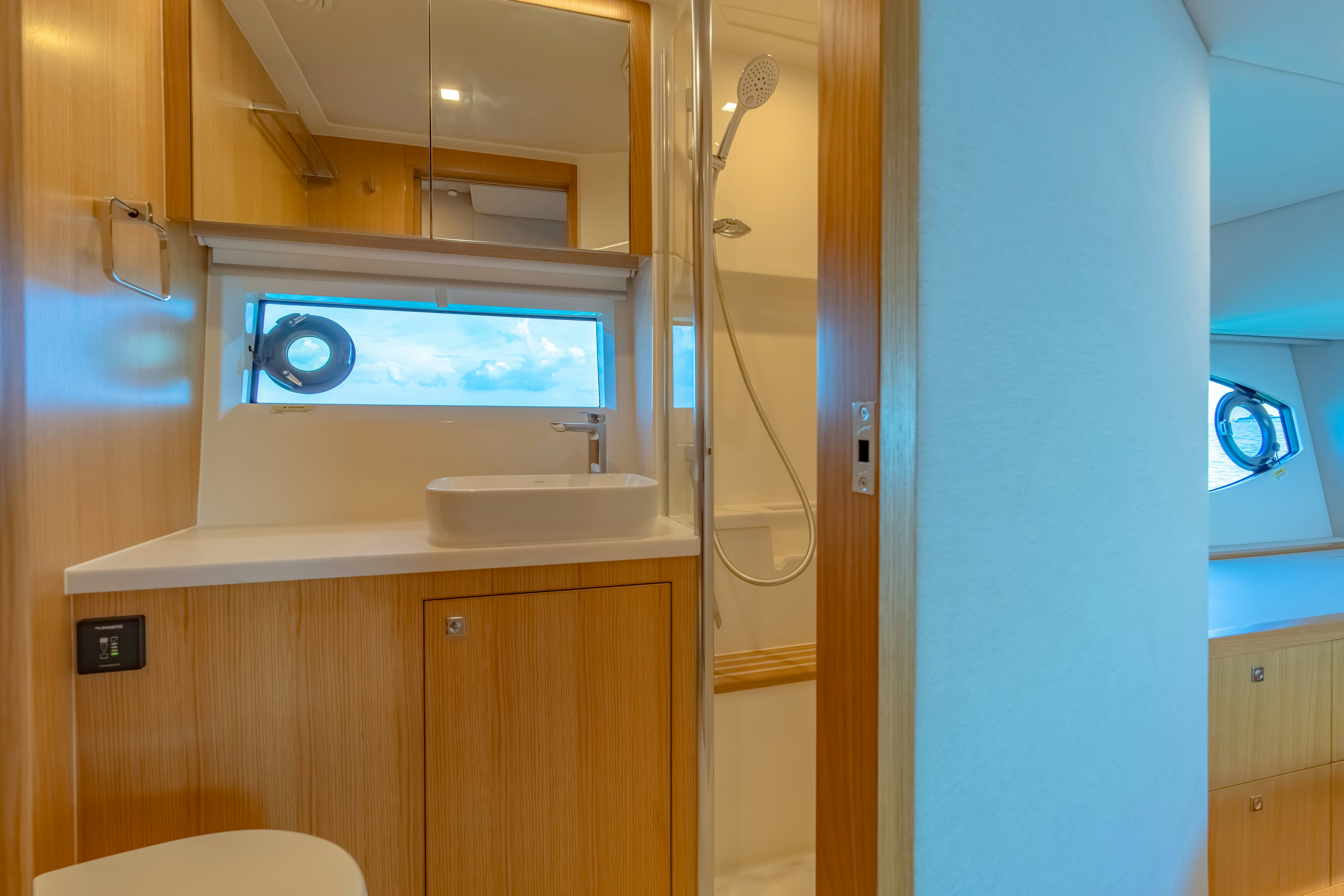 a bathroom with a sink and a shower aboard RIVIERA 4600 SPORT YACHT Yacht for Sale