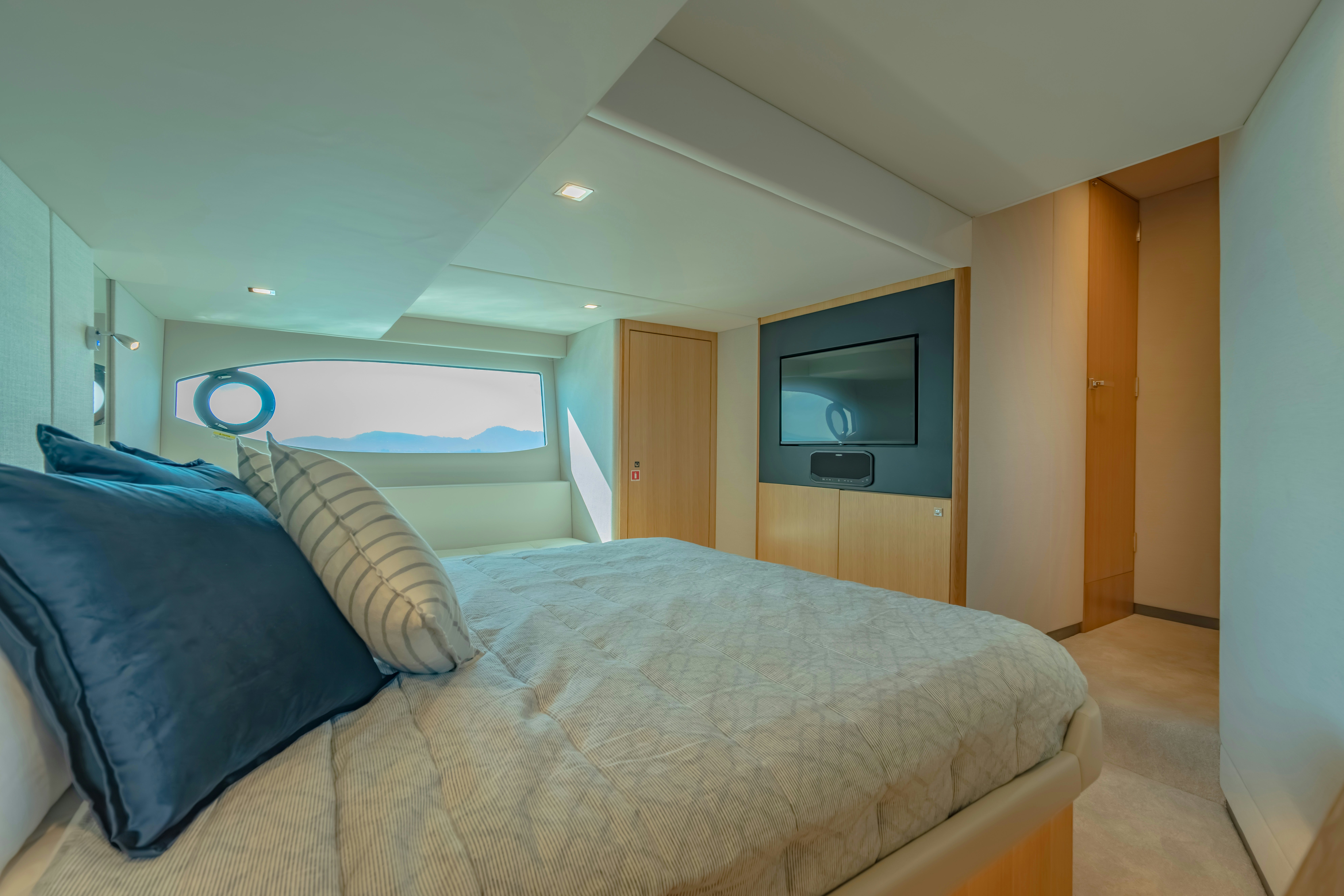 a bed in a room aboard RIVIERA 4600 SPORT YACHT Yacht for Sale