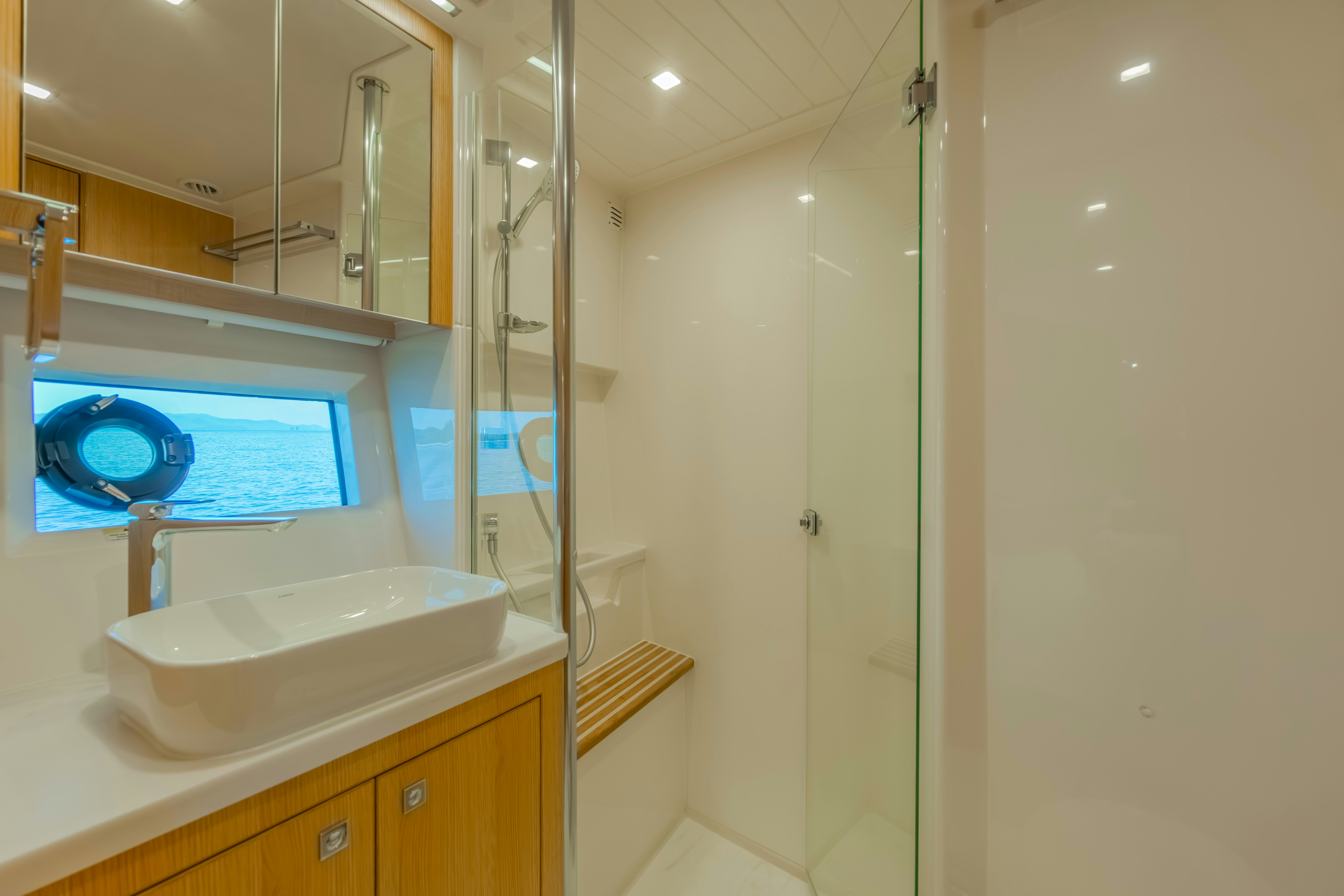 a bathroom with a sink and a shower aboard RIVIERA 4600 SPORT YACHT Yacht for Sale