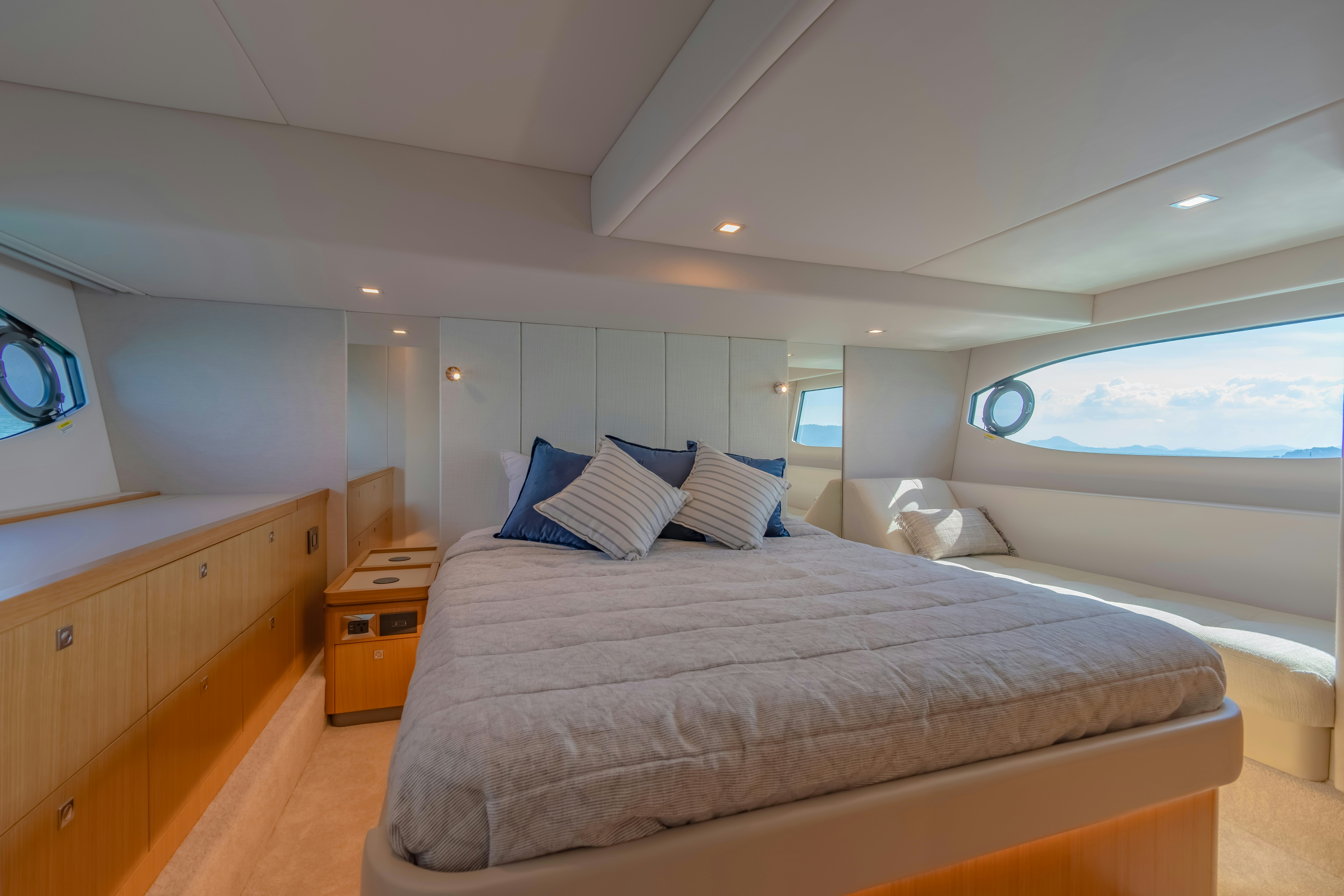a bedroom with a large bed aboard RIVIERA 4600 SPORT YACHT Yacht for Sale