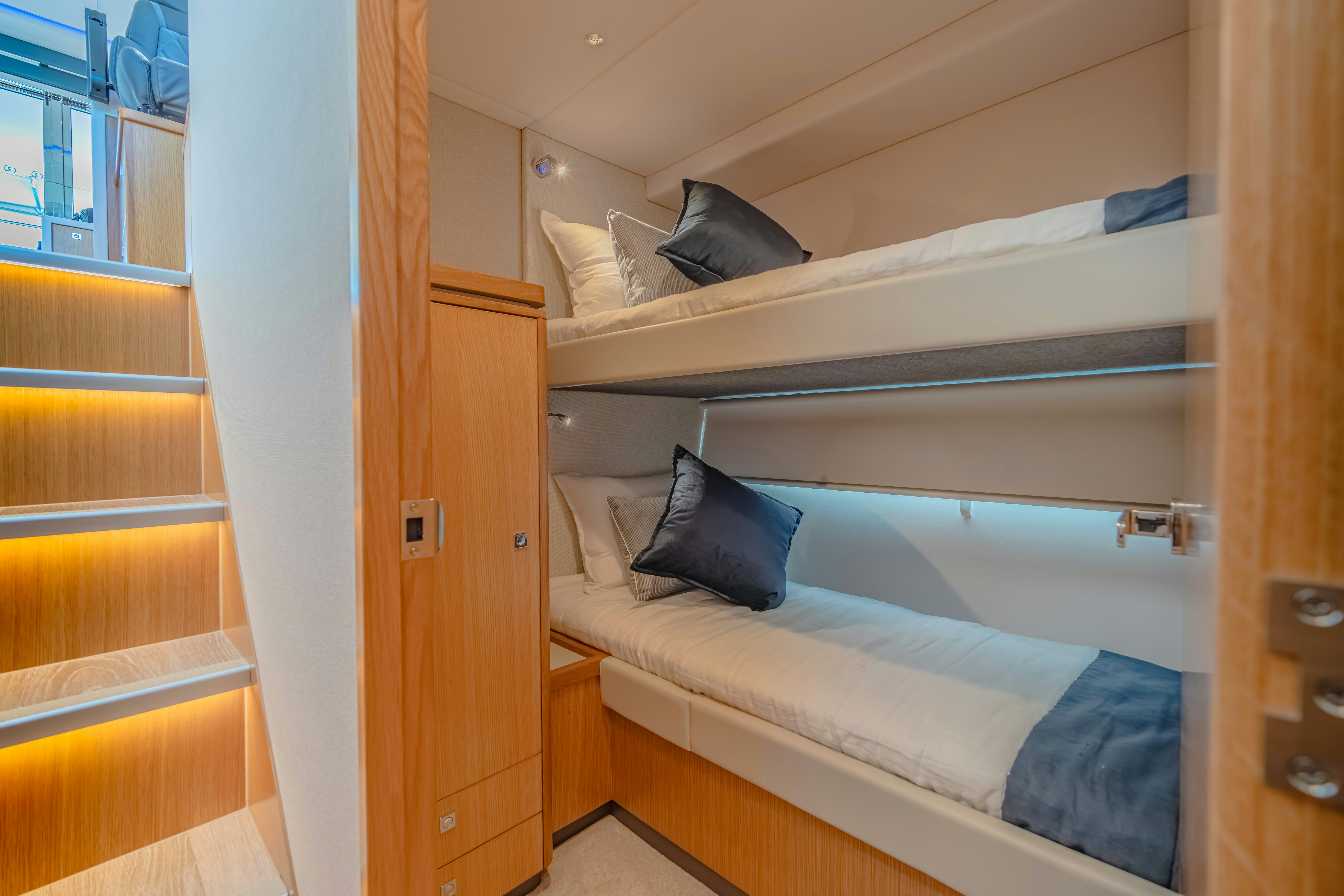 a bed in a room aboard RIVIERA 4600 SPORT YACHT Yacht for Sale