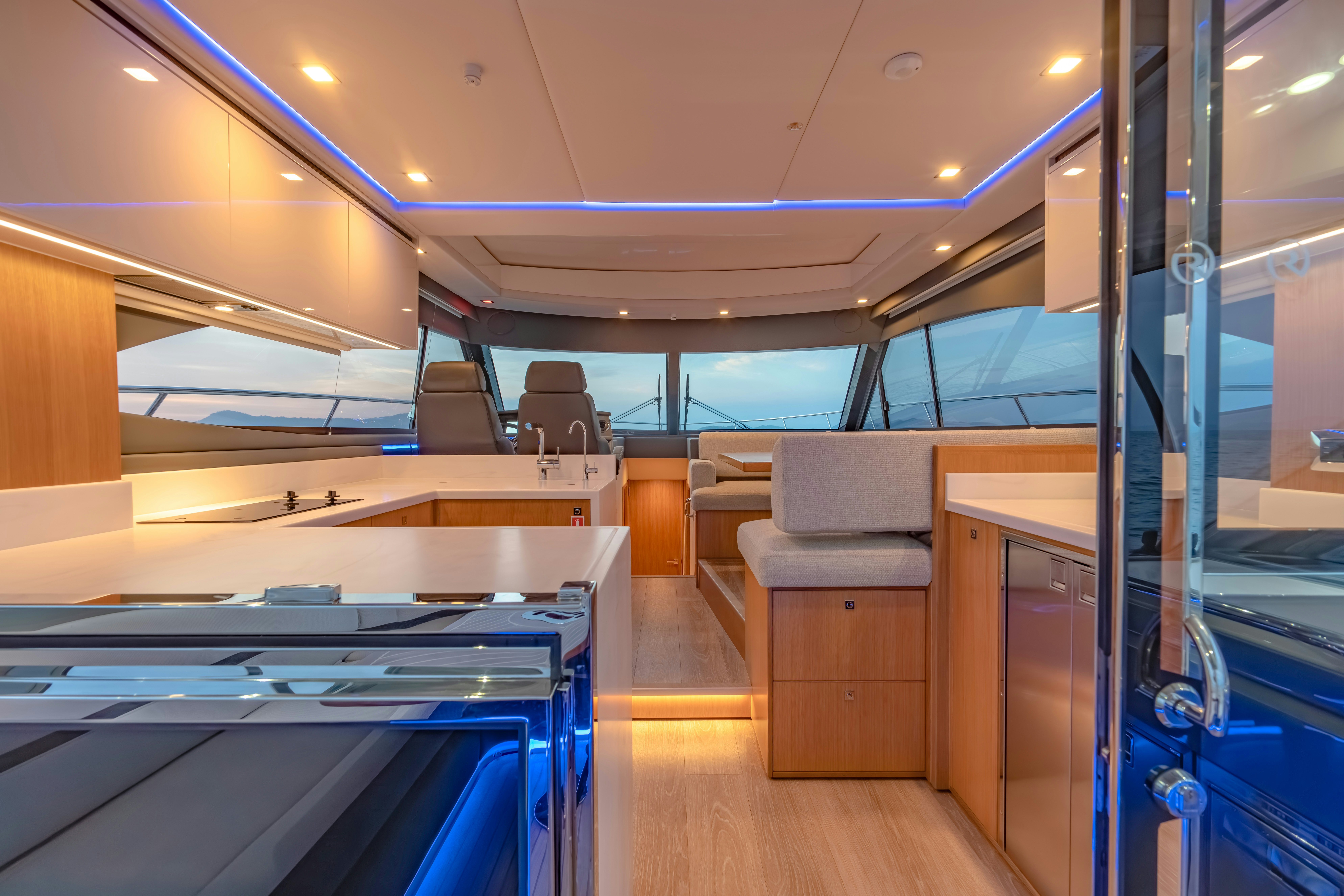 inside of a building with a pool table and chairs aboard RIVIERA 4600 SPORT YACHT Yacht for Sale