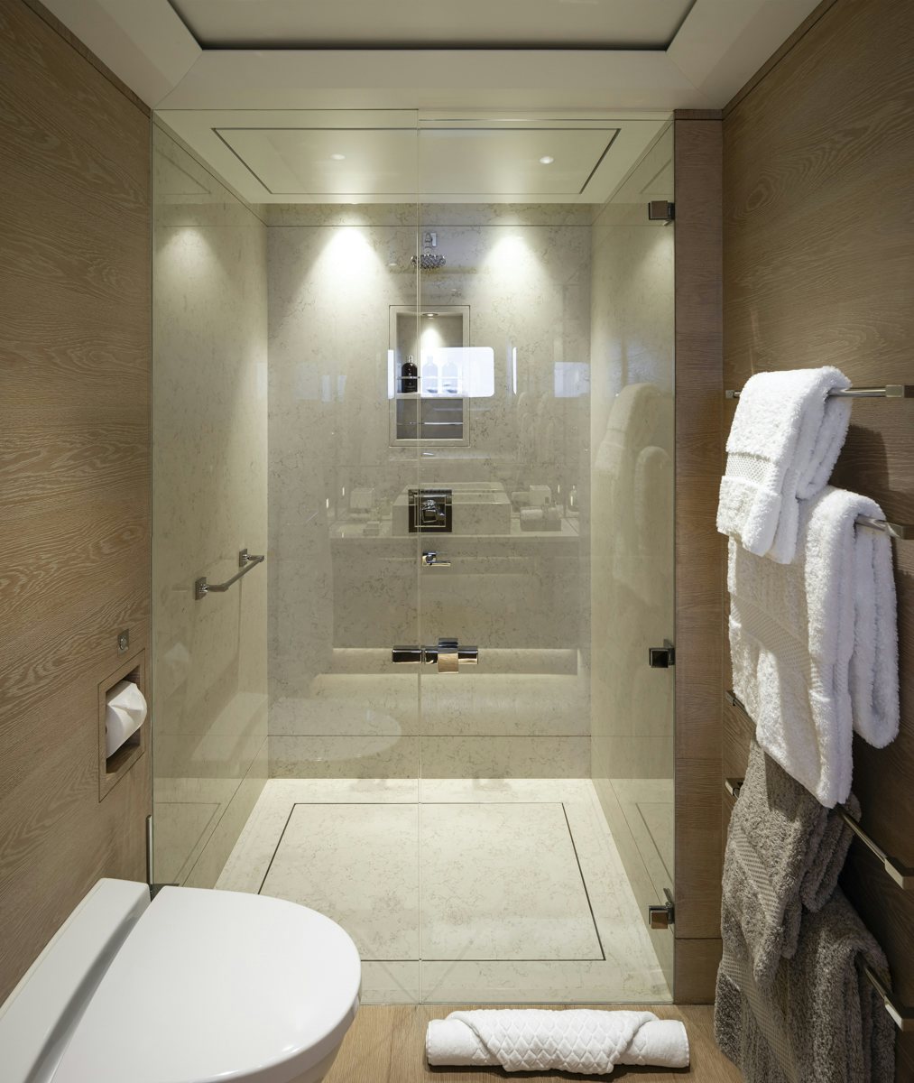a bathroom with a glass shower aboard TWIZZLE Yacht for Charter