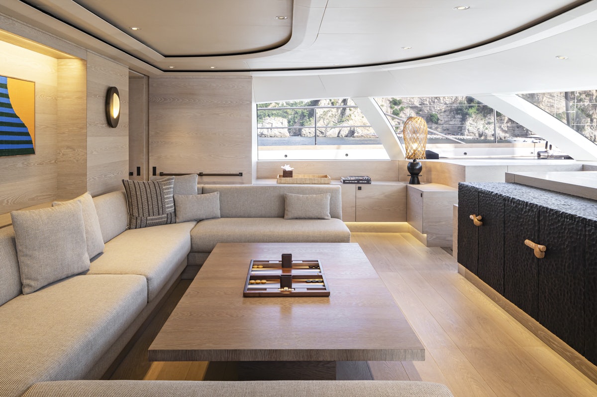a living room with a large window aboard TWIZZLE Yacht for Charter