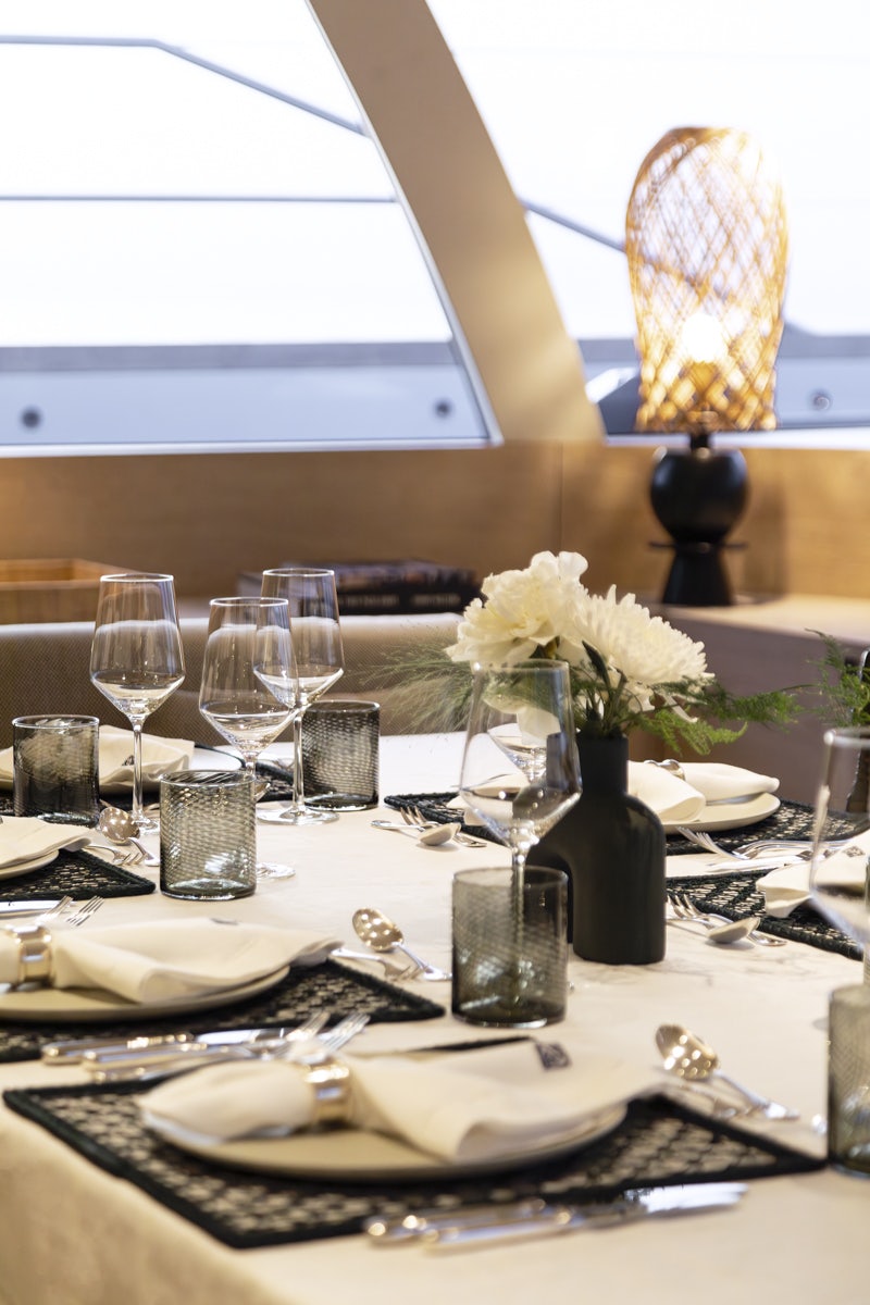 a table with place settings aboard TWIZZLE Yacht for Charter