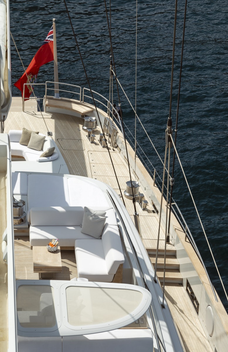 a boat with a red flag on the front aboard TWIZZLE Yacht for Charter