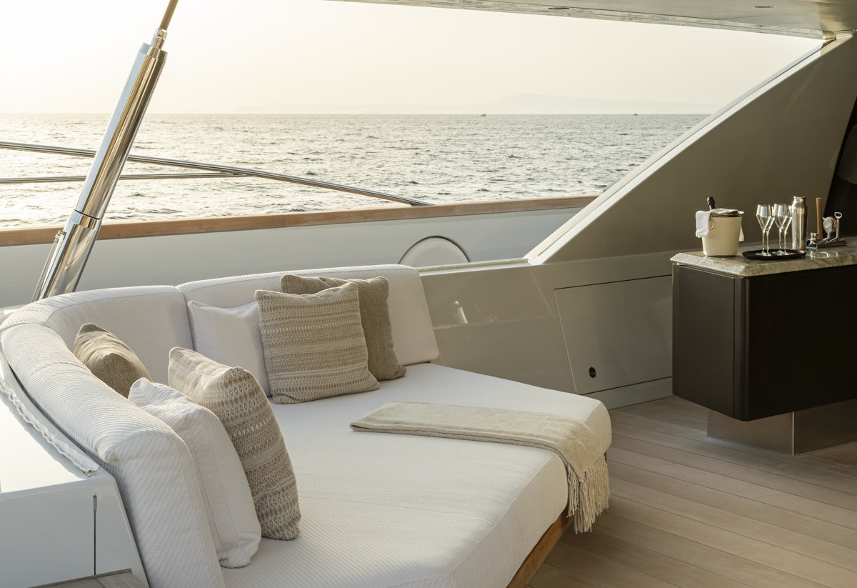 a room with a bed and a table aboard TWIZZLE Yacht for Charter