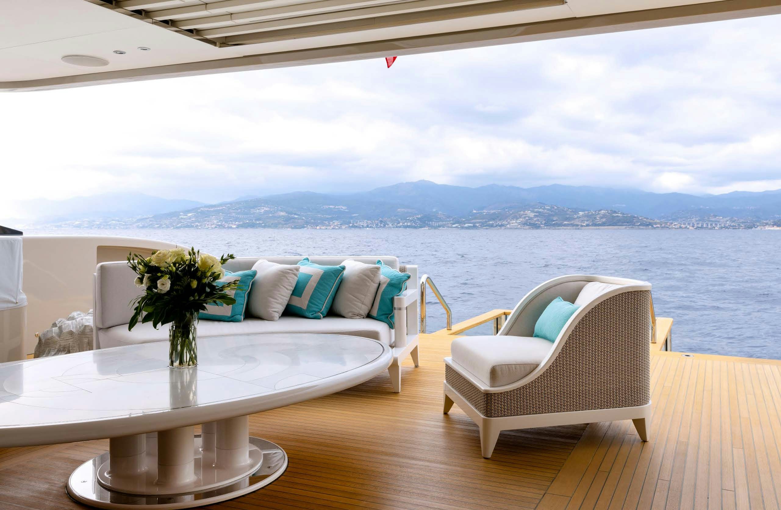 a room with a table and chairs aboard IRYNA II Yacht for Sale