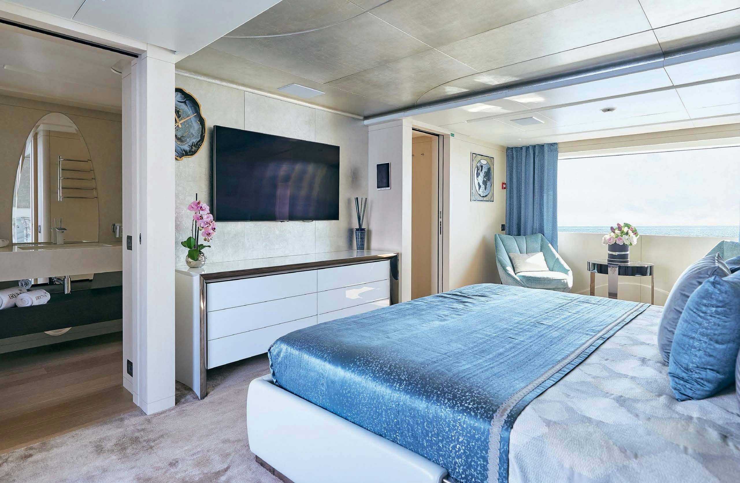 a bedroom with a large bed aboard IRYNA II Yacht for Sale
