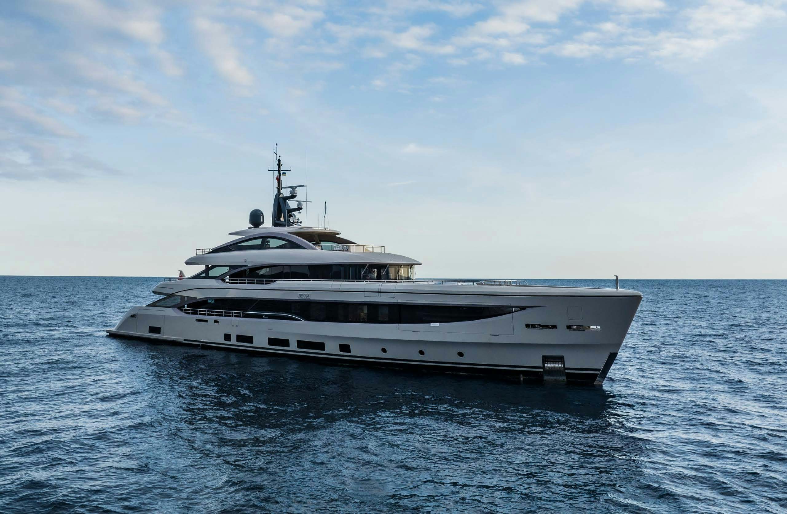 a white yacht in the water aboard IRYNA II Yacht for Sale