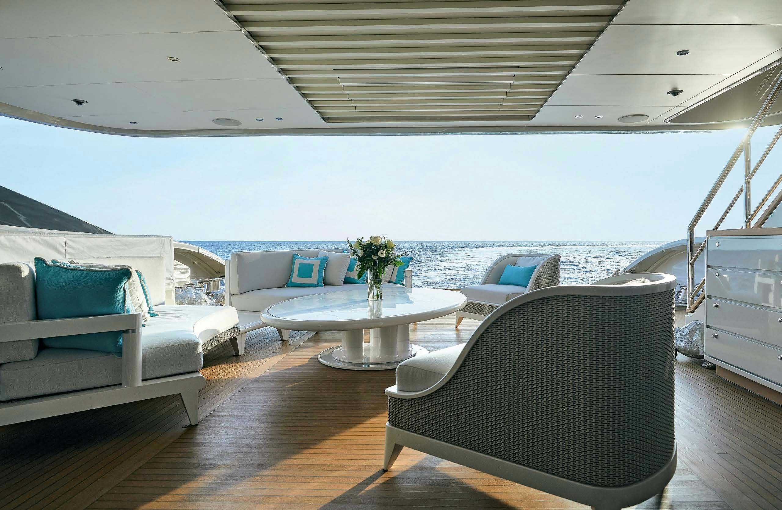 a living room with a large balcony aboard IRYNA II Yacht for Sale