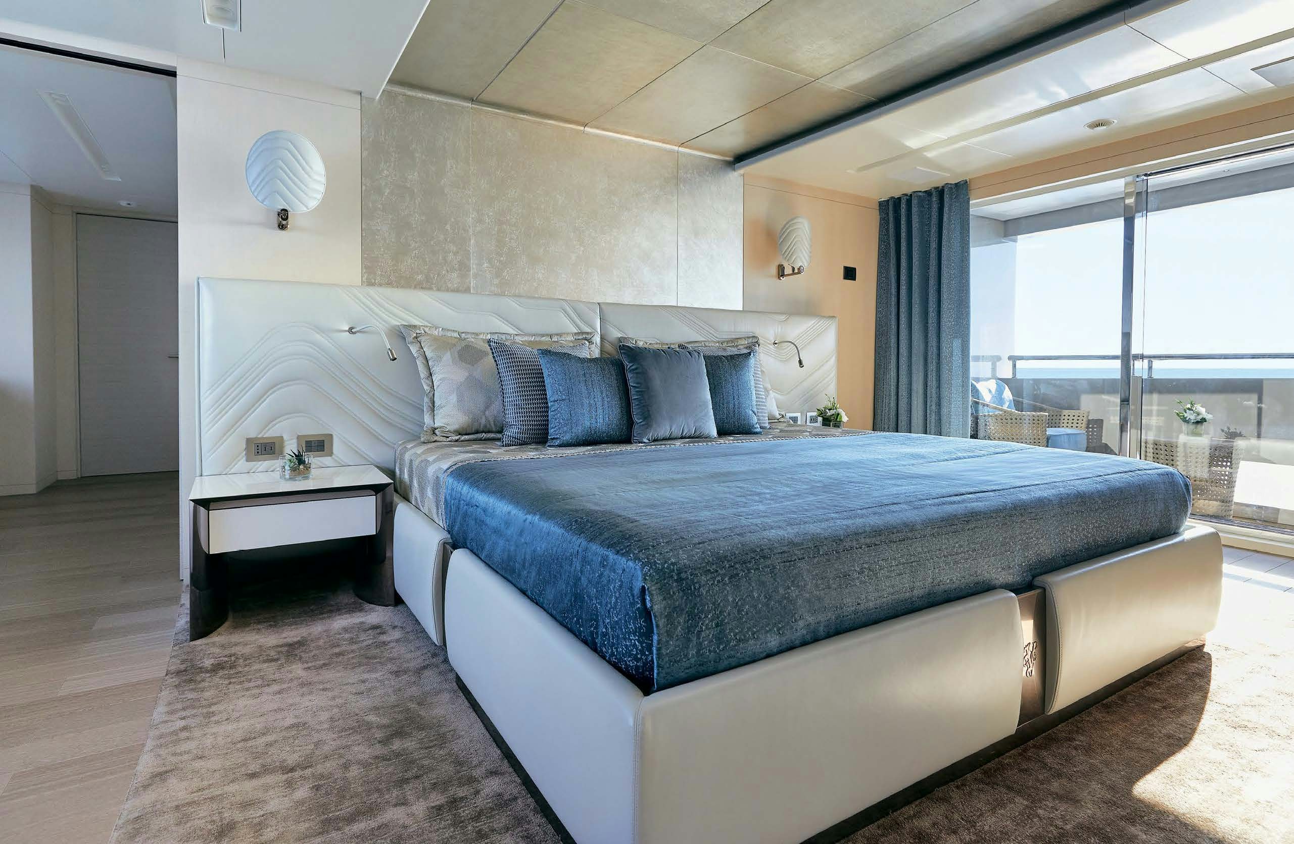 a bed in a room aboard IRYNA II Yacht for Sale
