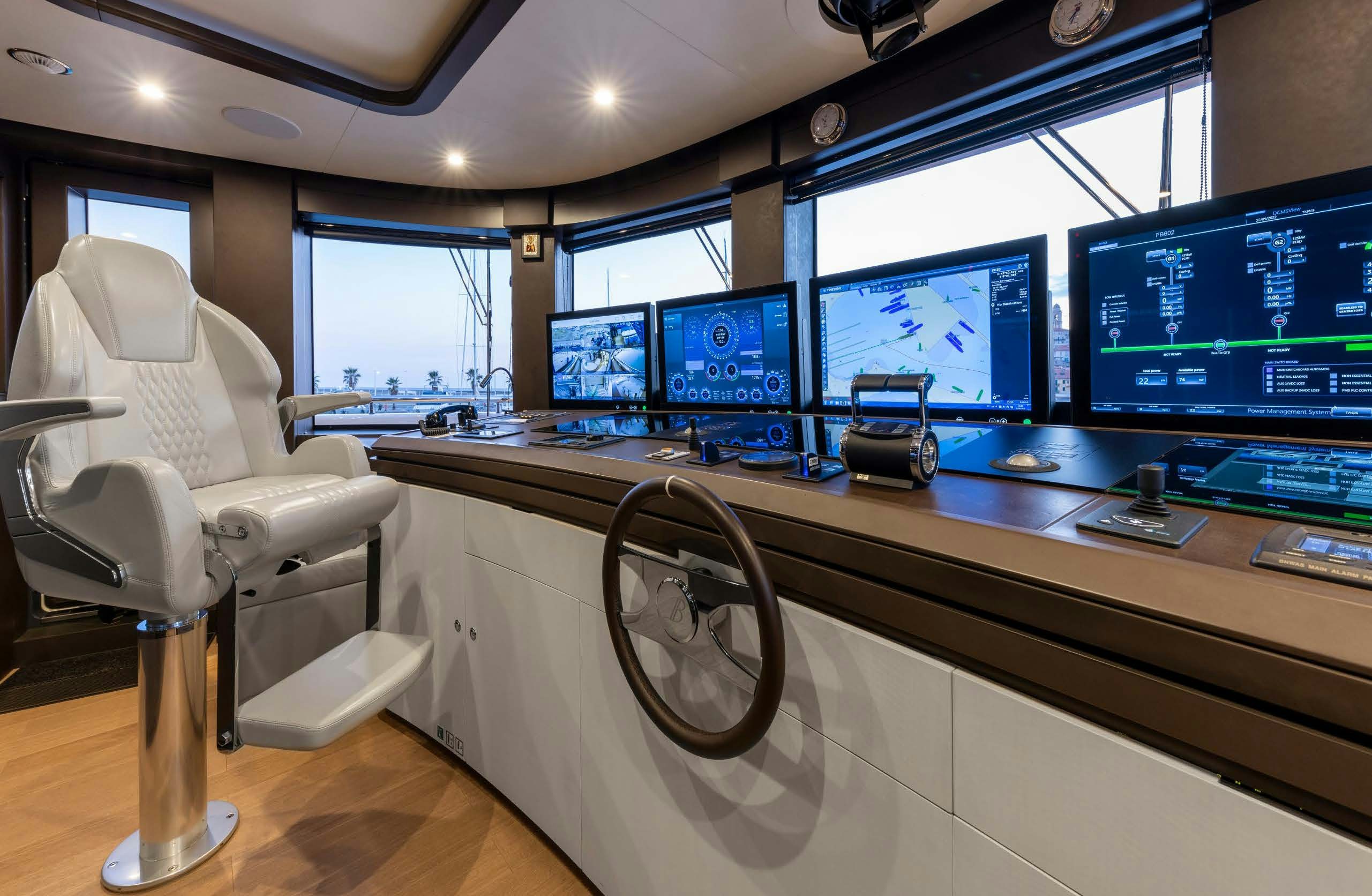 a room with a desk and a chair and a large window aboard IRYNA II Yacht for Sale