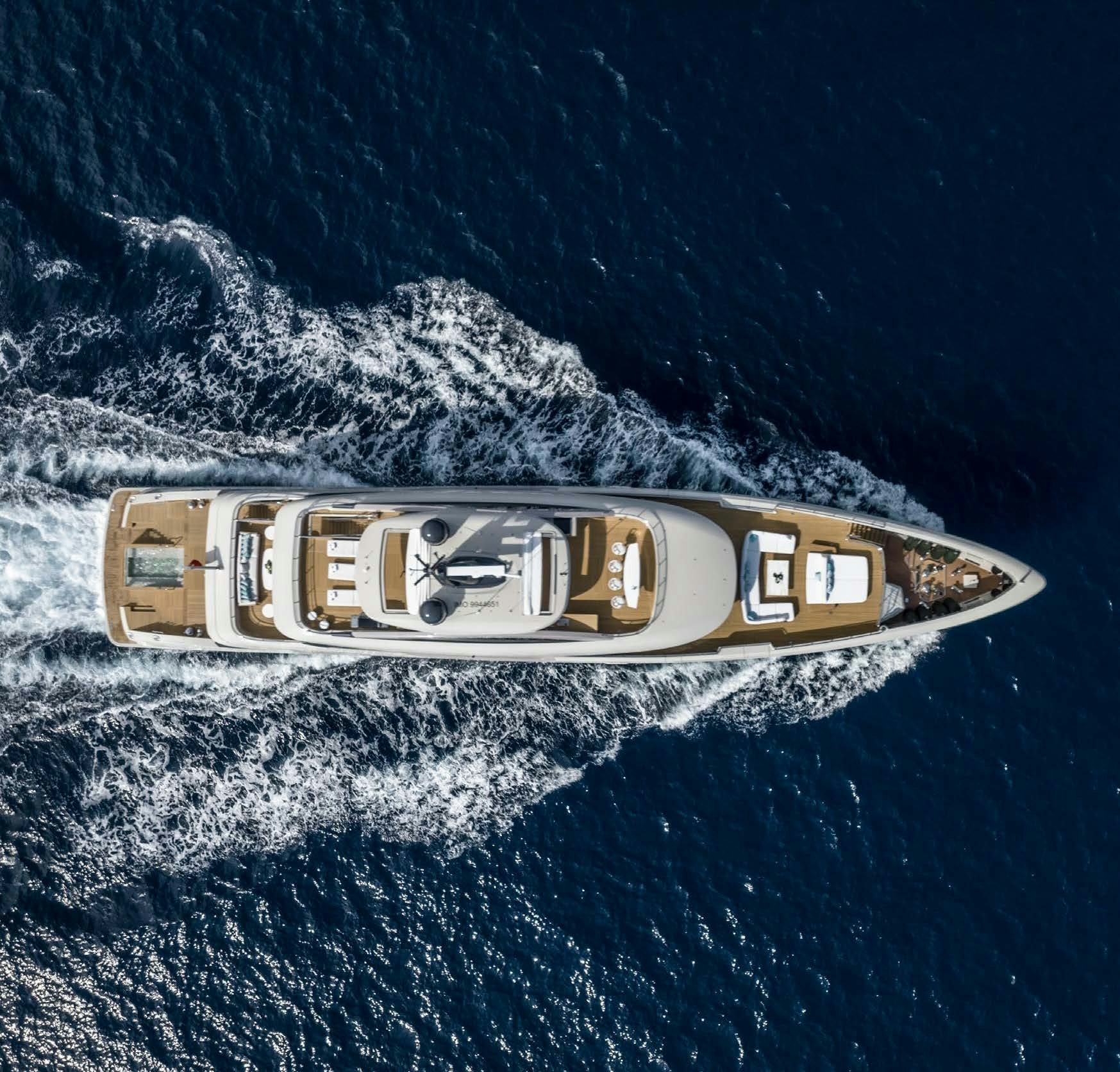 a gold and silver logo on a surface with a black background aboard IRYNA II Yacht for Sale