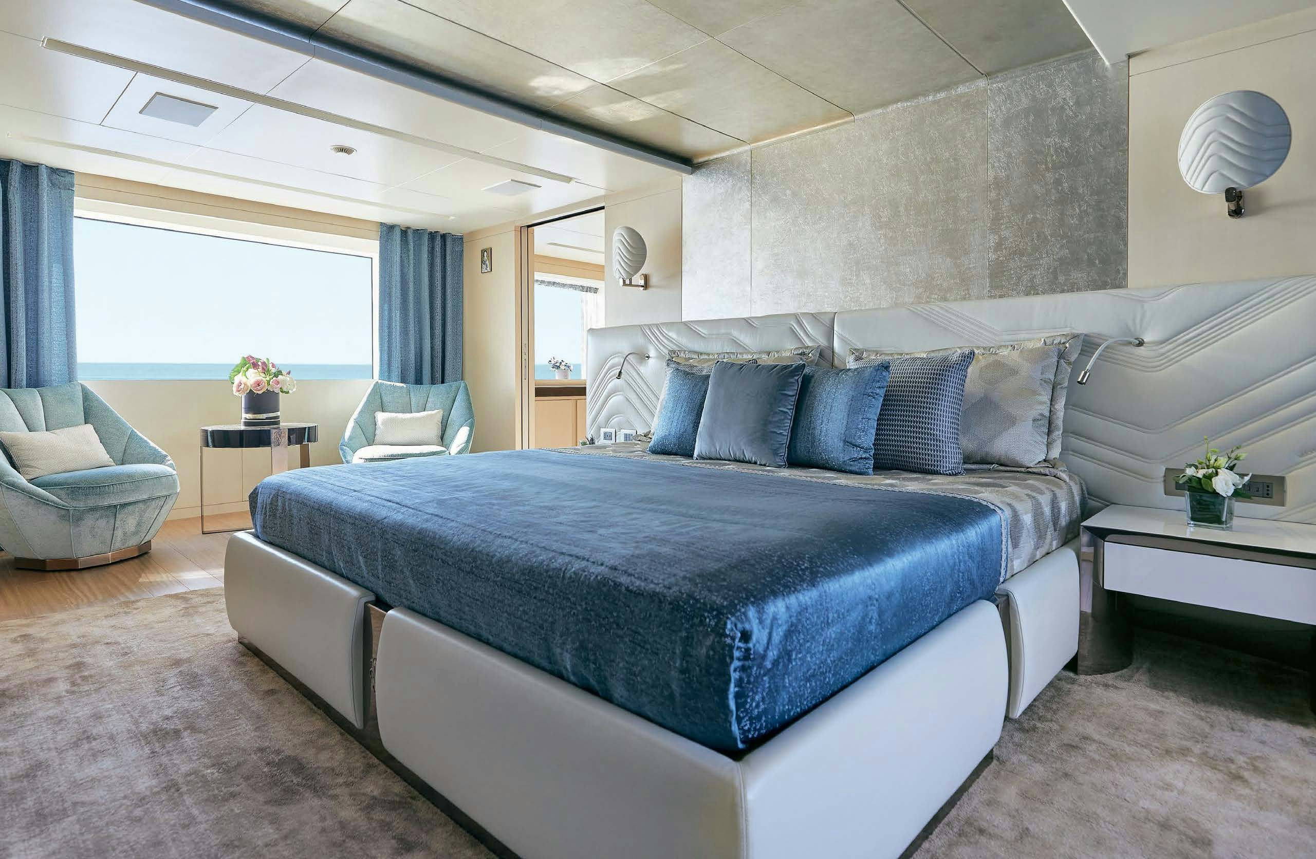 a bed in a room aboard IRYNA II Yacht for Sale