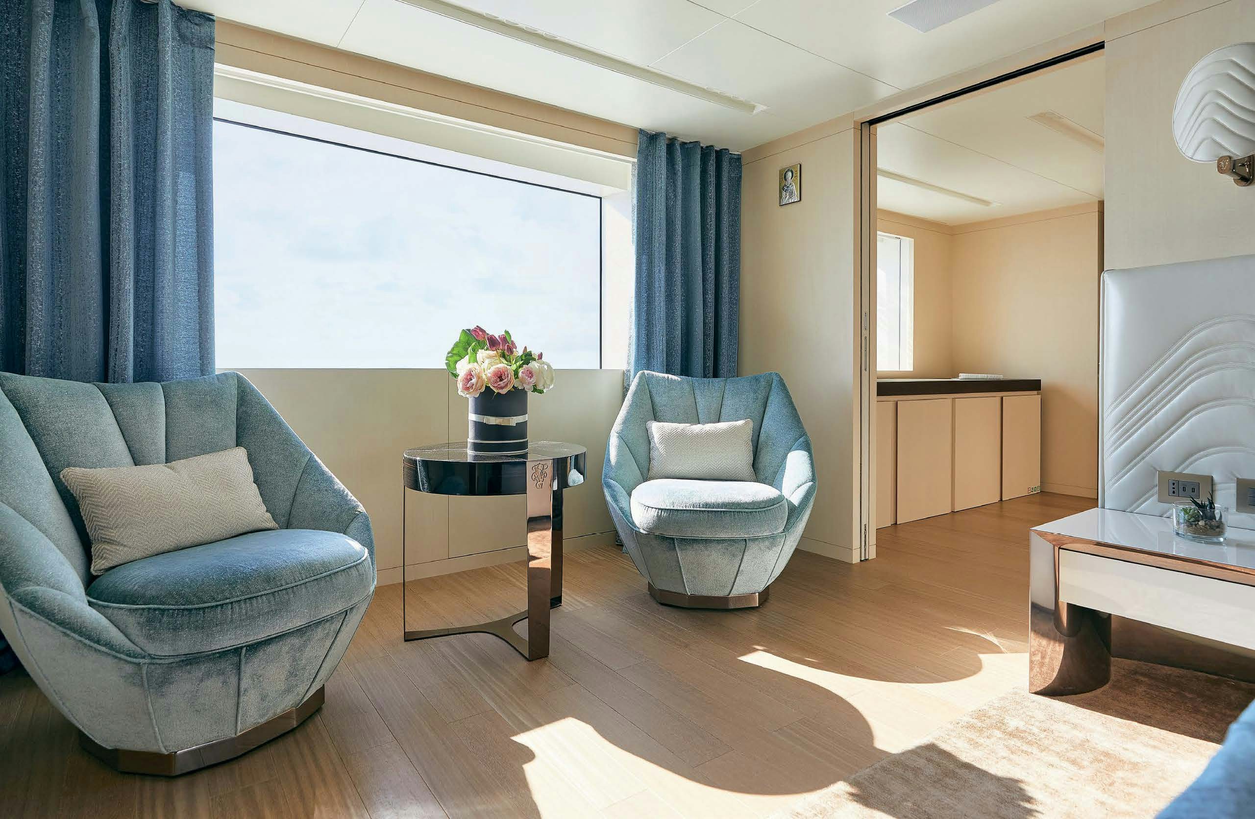a living room with a fireplace aboard IRYNA II Yacht for Sale