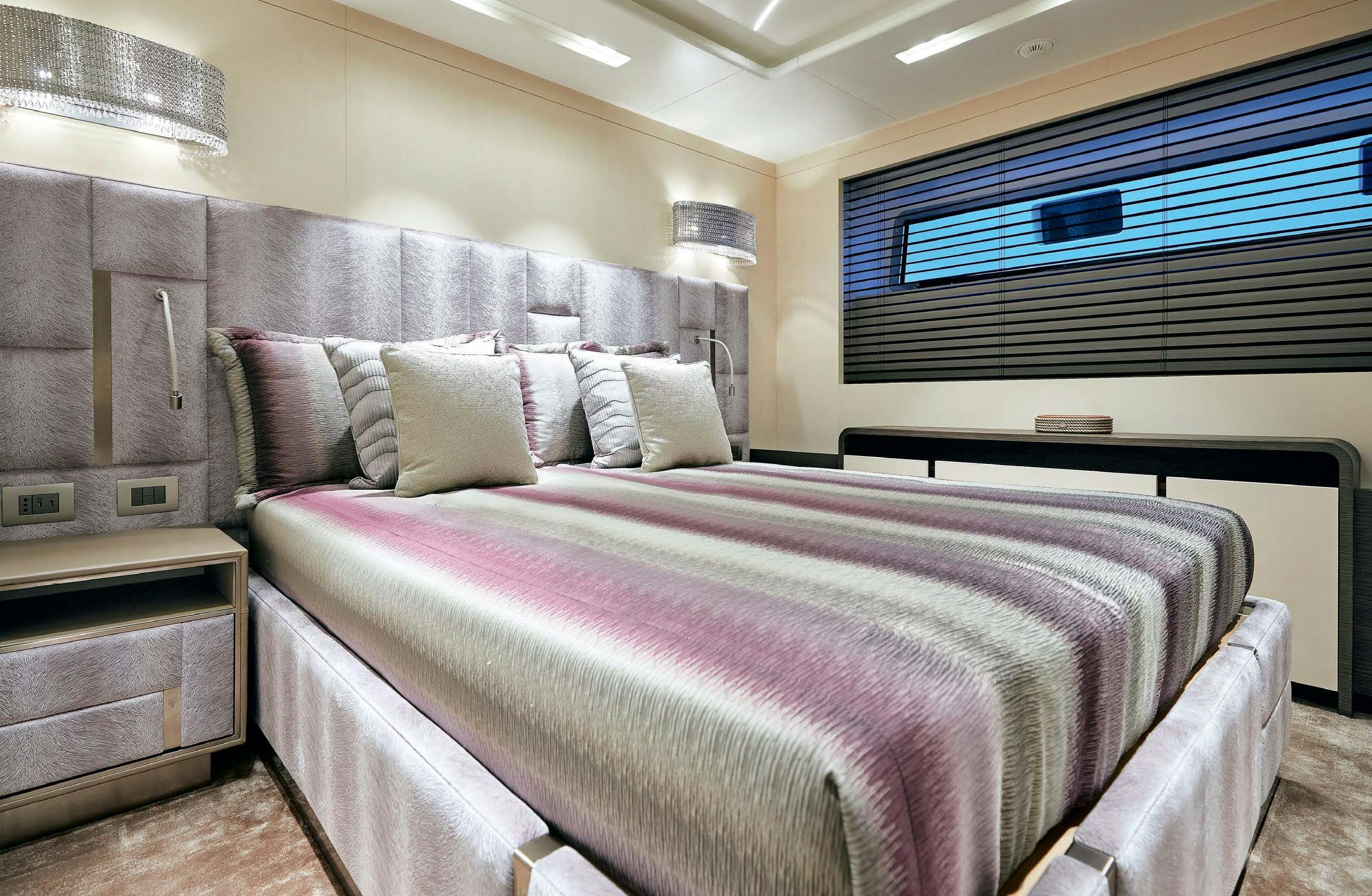 a bed in a room aboard IRYNA II Yacht for Sale