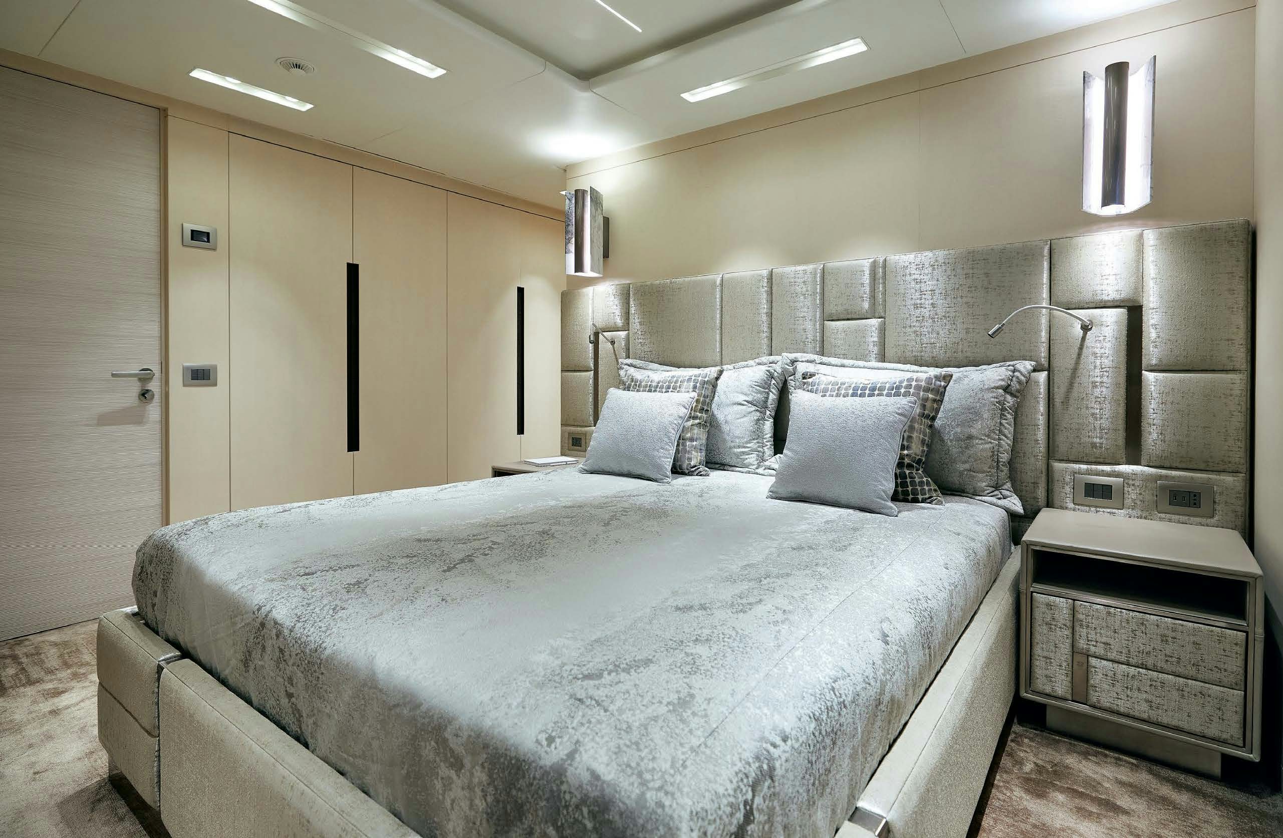 a large bed in a room aboard IRYNA II Yacht for Sale