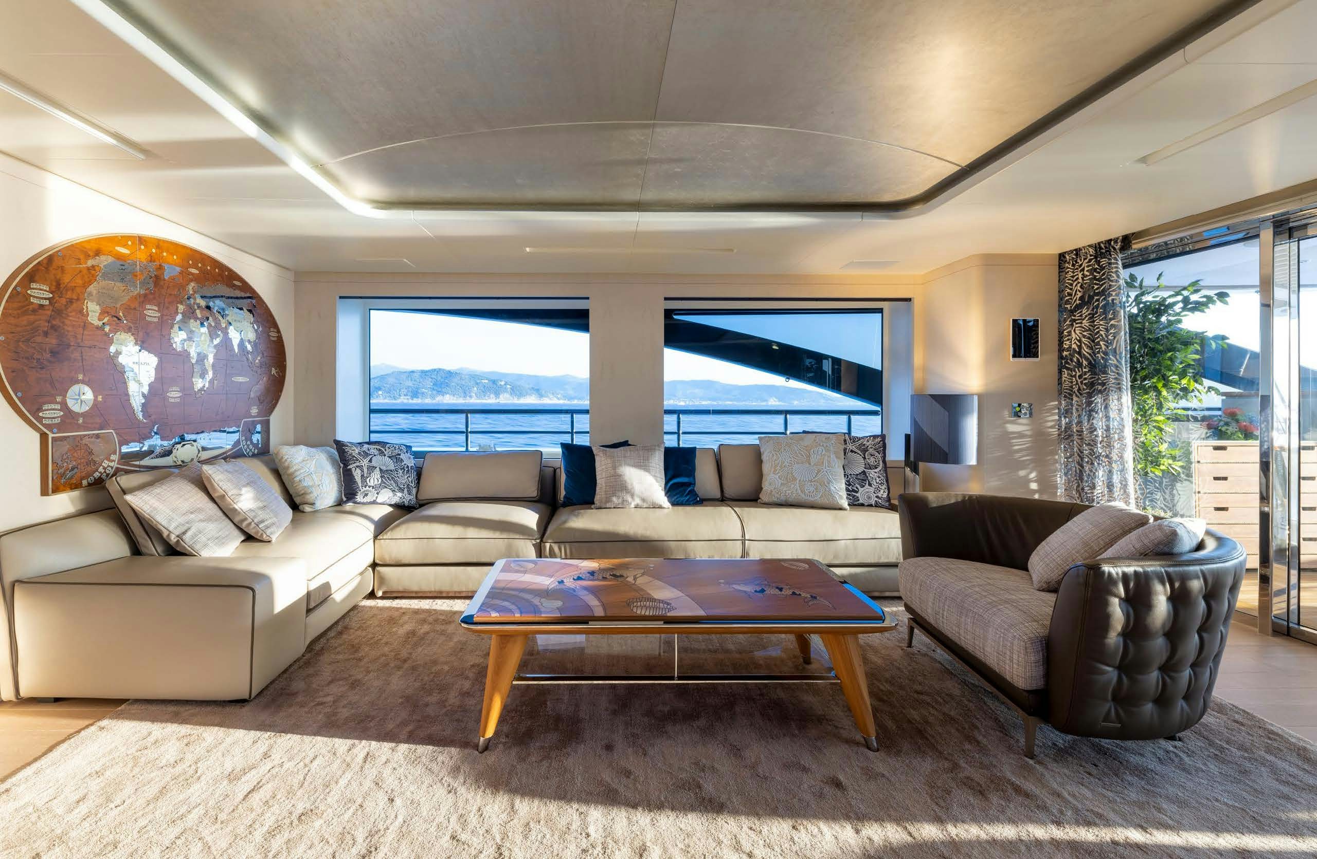 a living room with a large window aboard IRYNA II Yacht for Sale