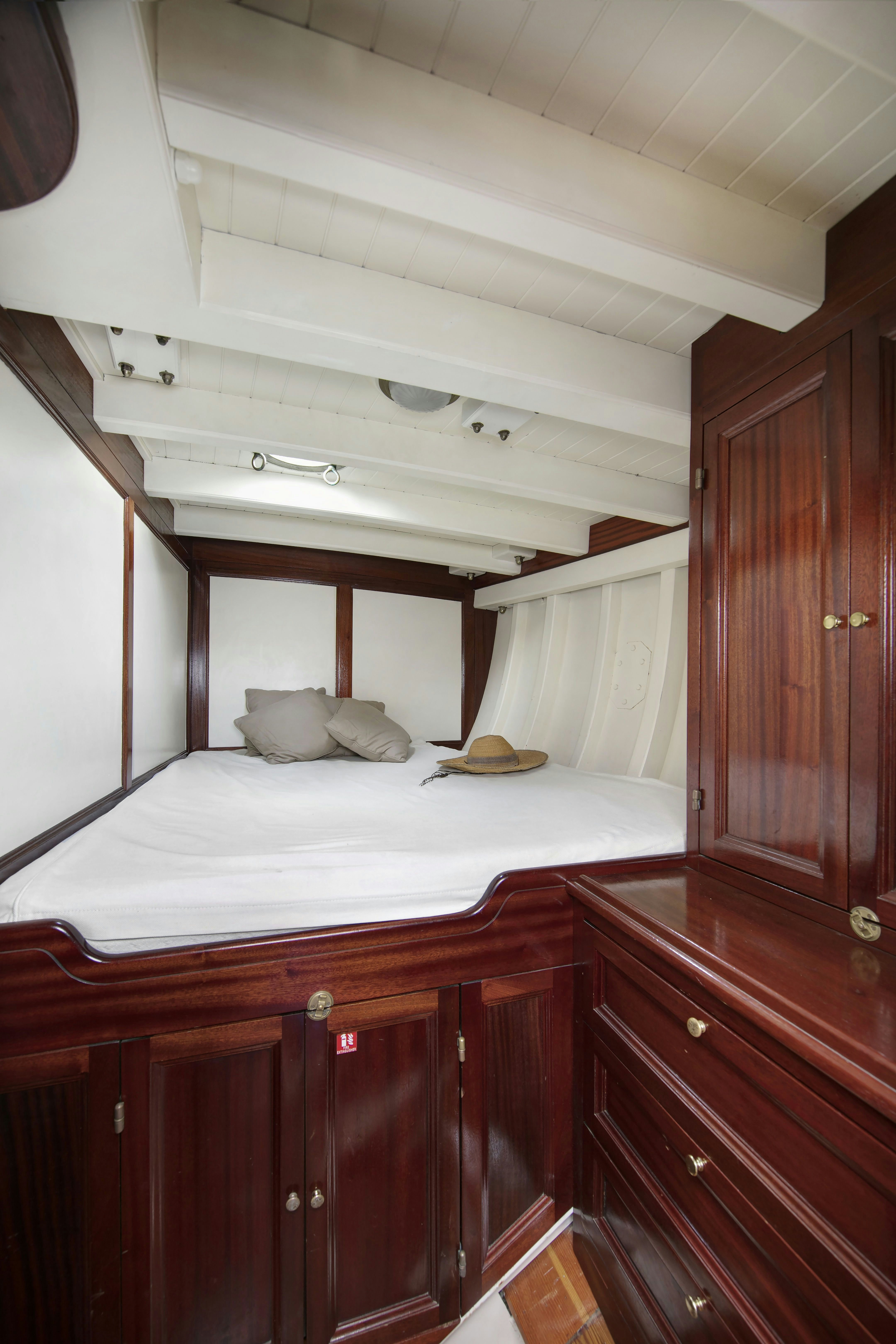 a bed in a room aboard MARISKA Yacht for Sale