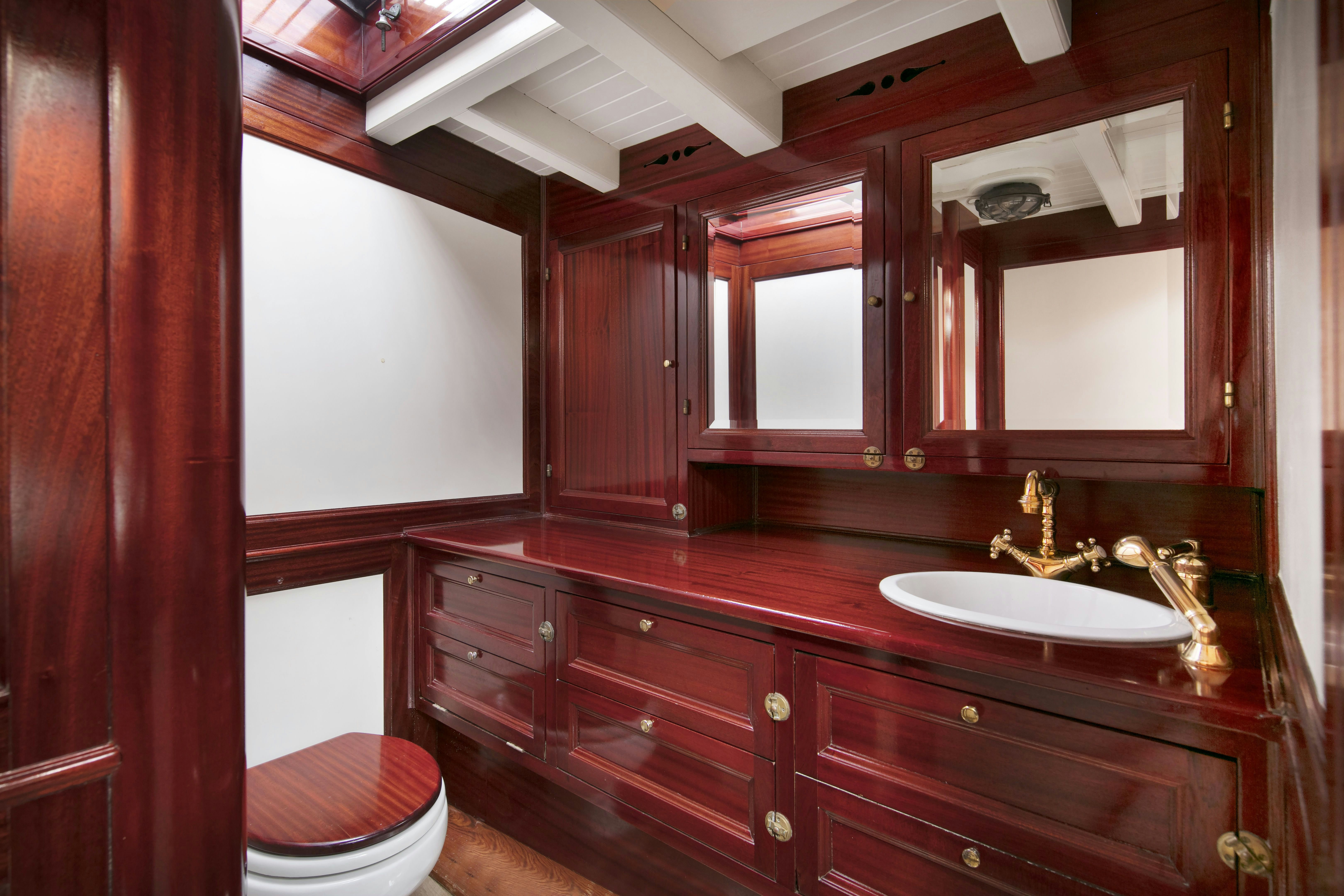 a bathroom with a sink and a toilet aboard MARISKA Yacht for Sale