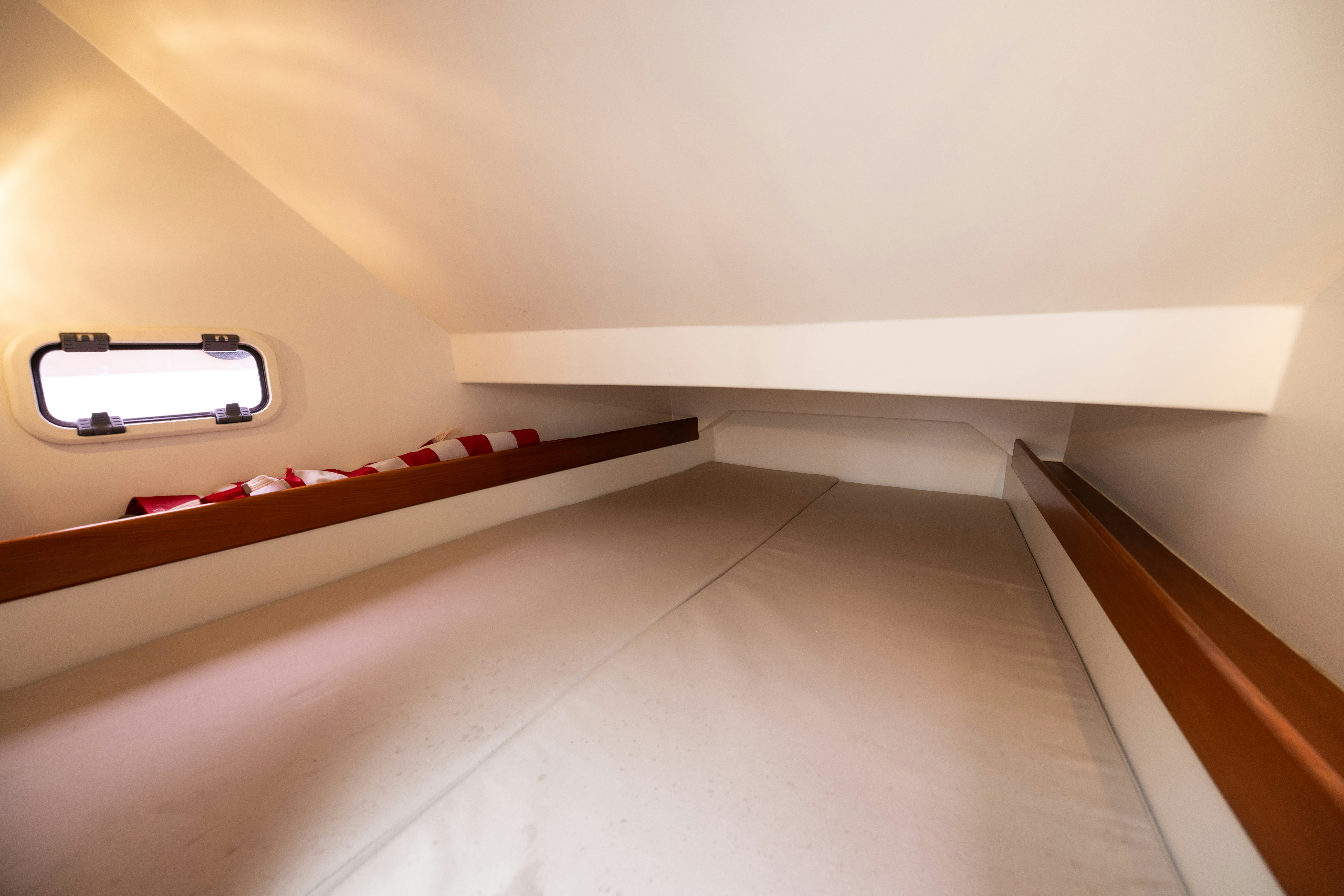 a white wall with a red line aboard FAN SEA II Yacht for Sale