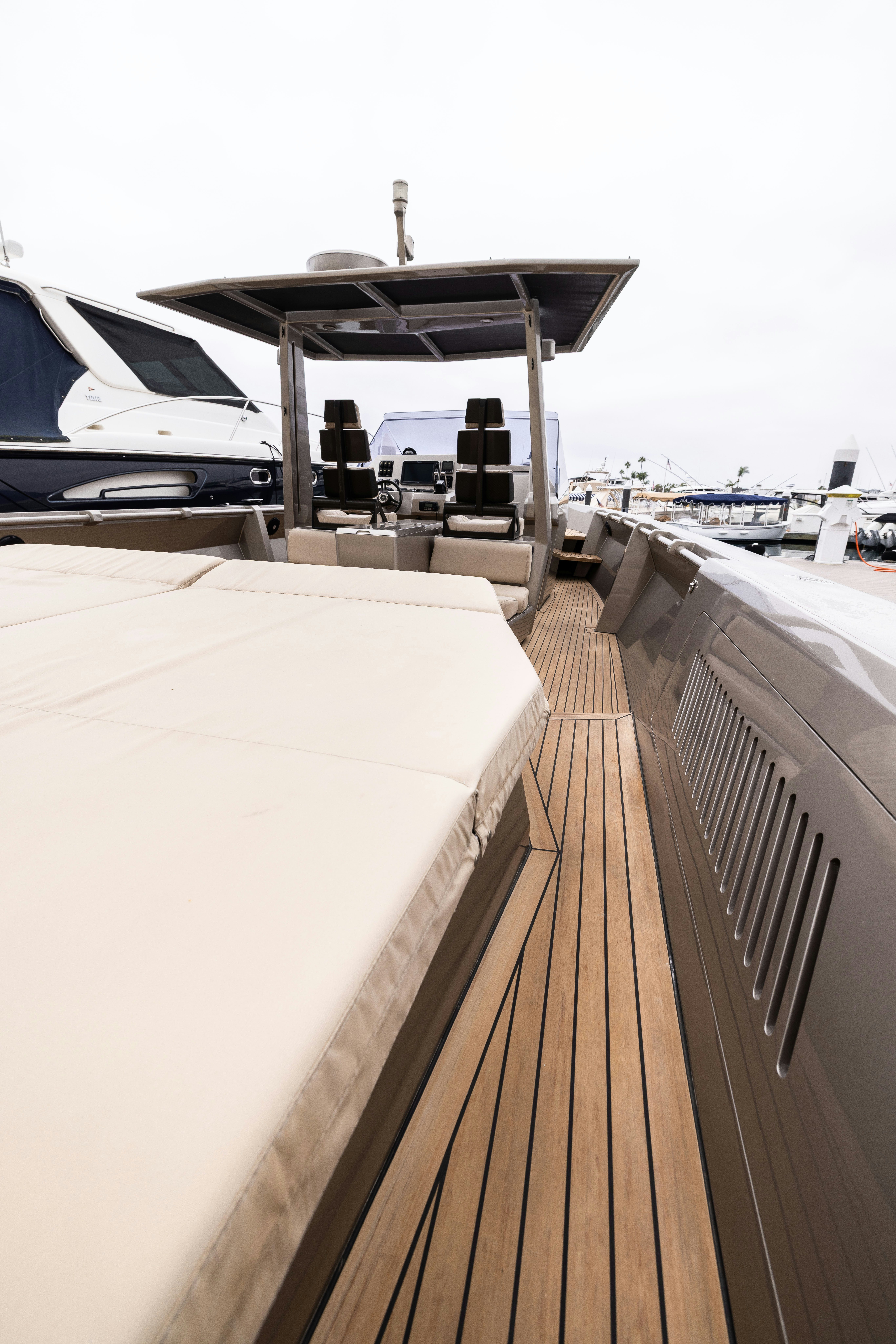 a deck with a large deck and a large grill on the deck aboard FAN SEA II Yacht for Sale