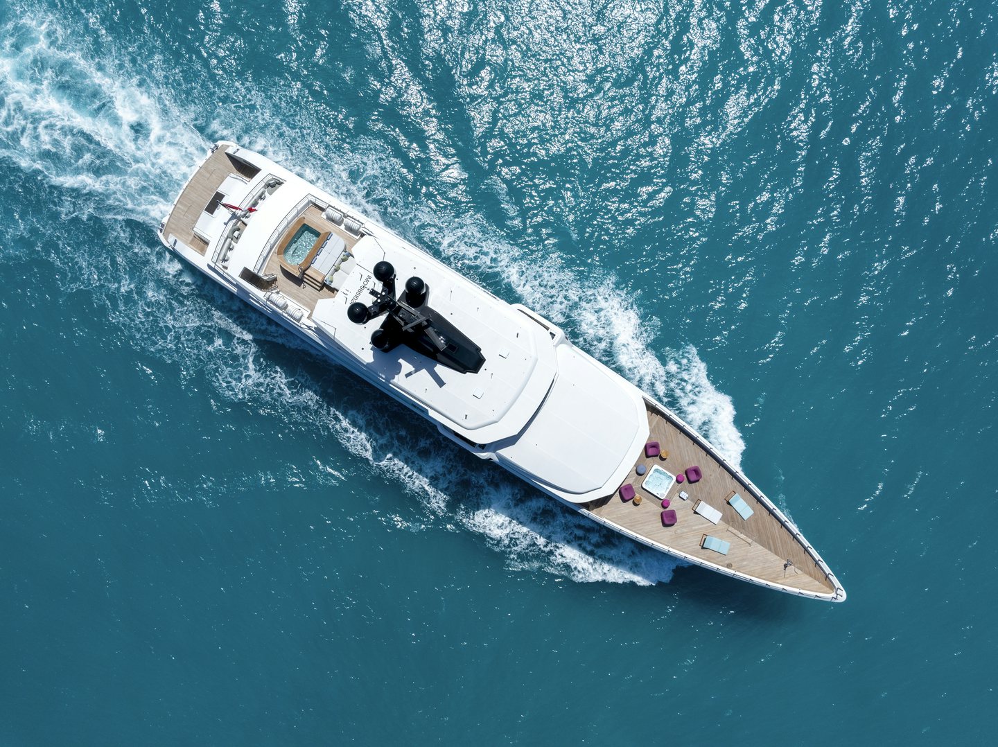 a white boat in the water aboard RIO Yacht for Charter