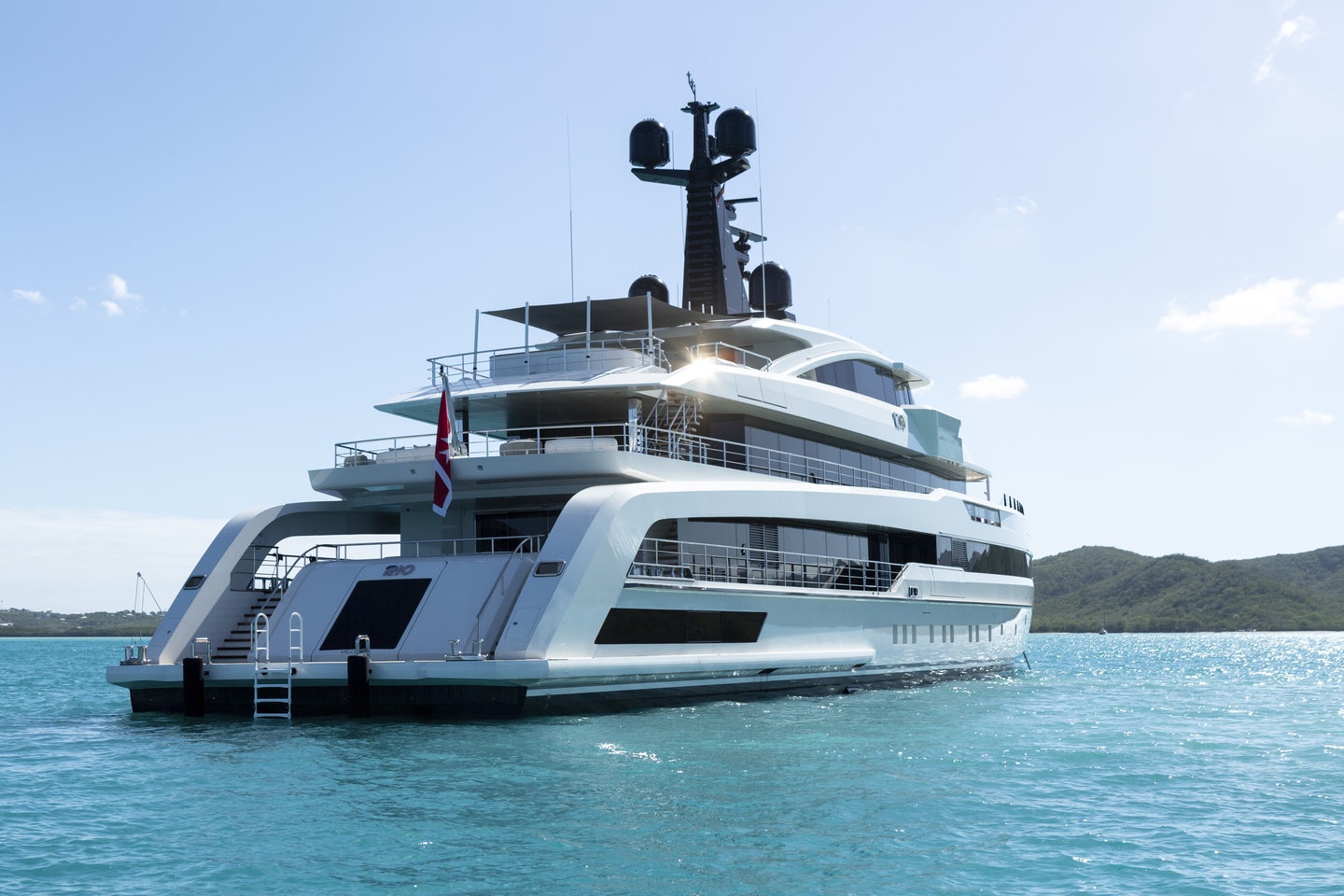 a white boat in the water aboard RIO Yacht for Charter