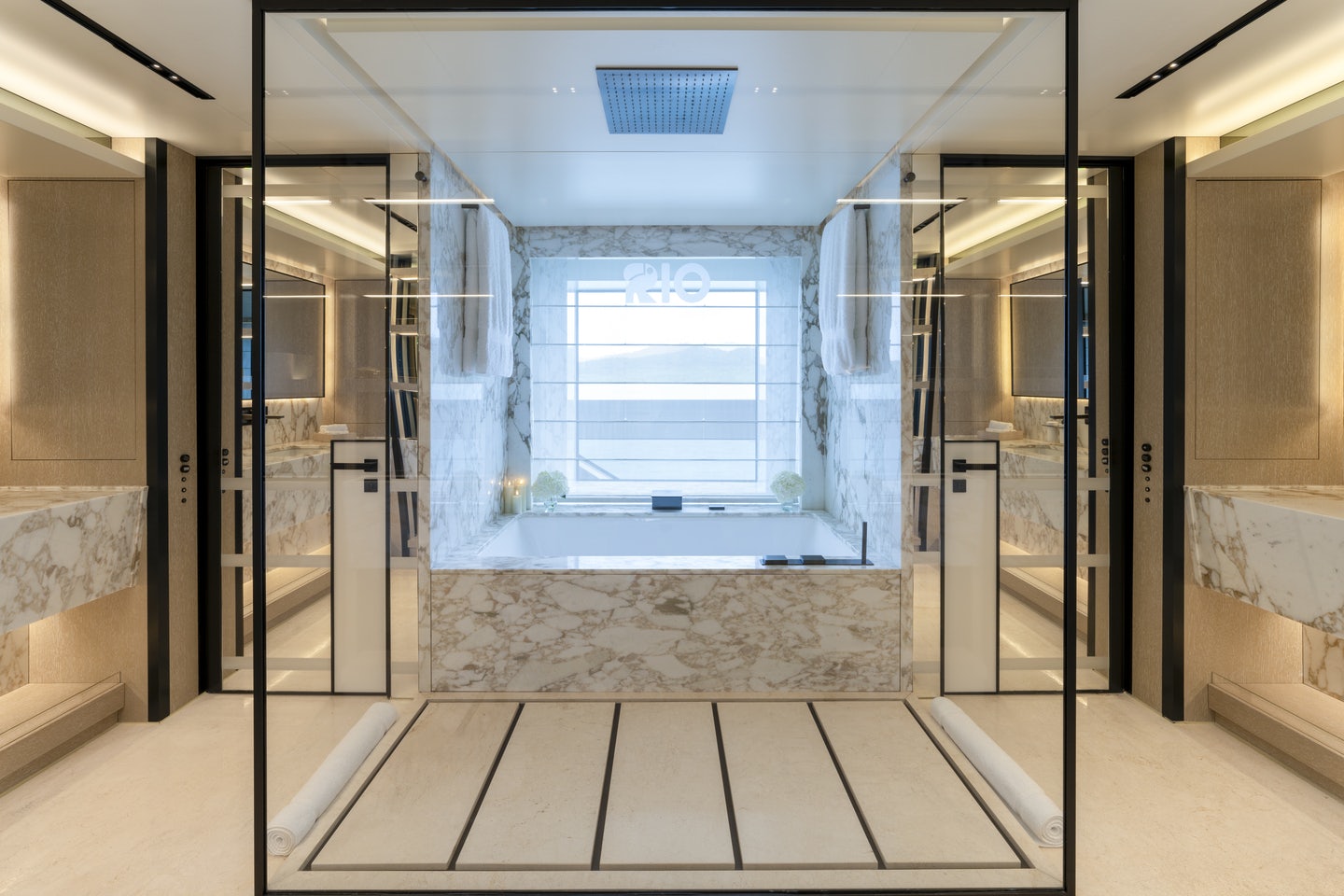 a room with glass walls and a tile floor aboard RIO Yacht for Charter