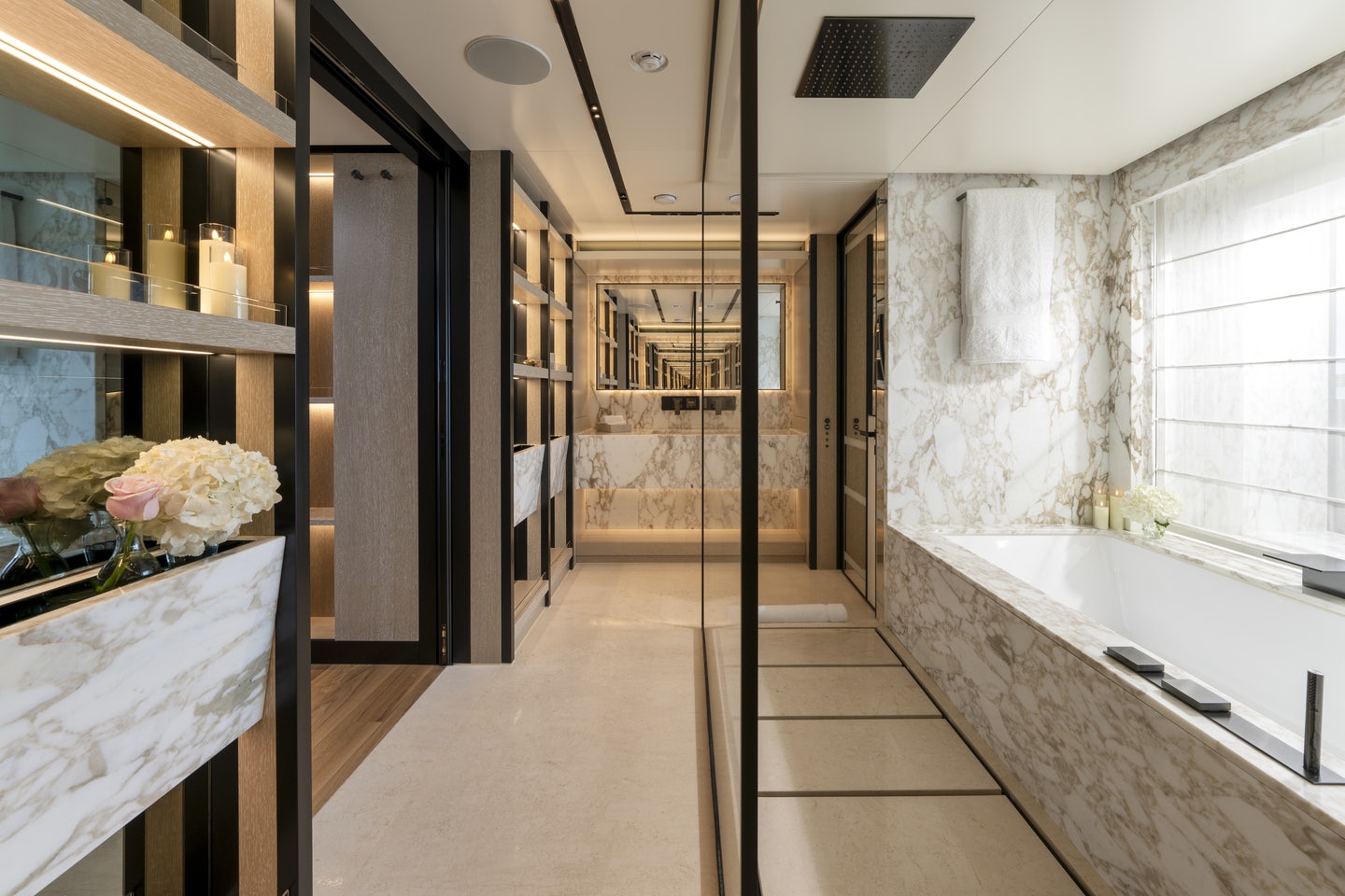 a bathroom with a tub and shower aboard RIO Yacht for Charter