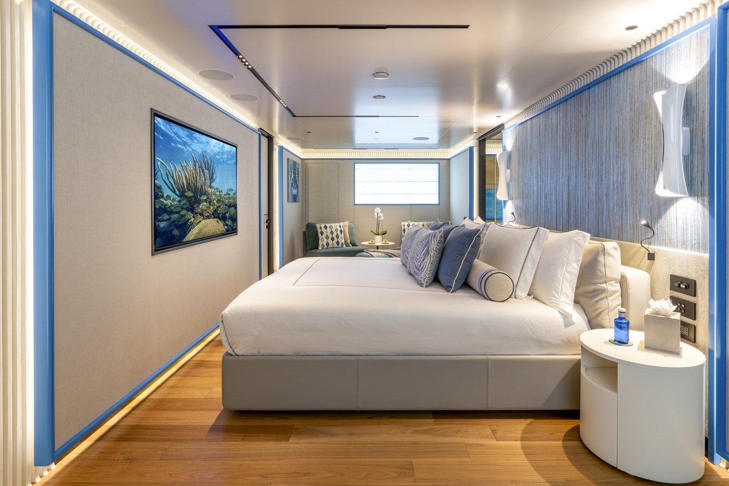 a living room with a couch and a table aboard RIO Yacht for Charter
