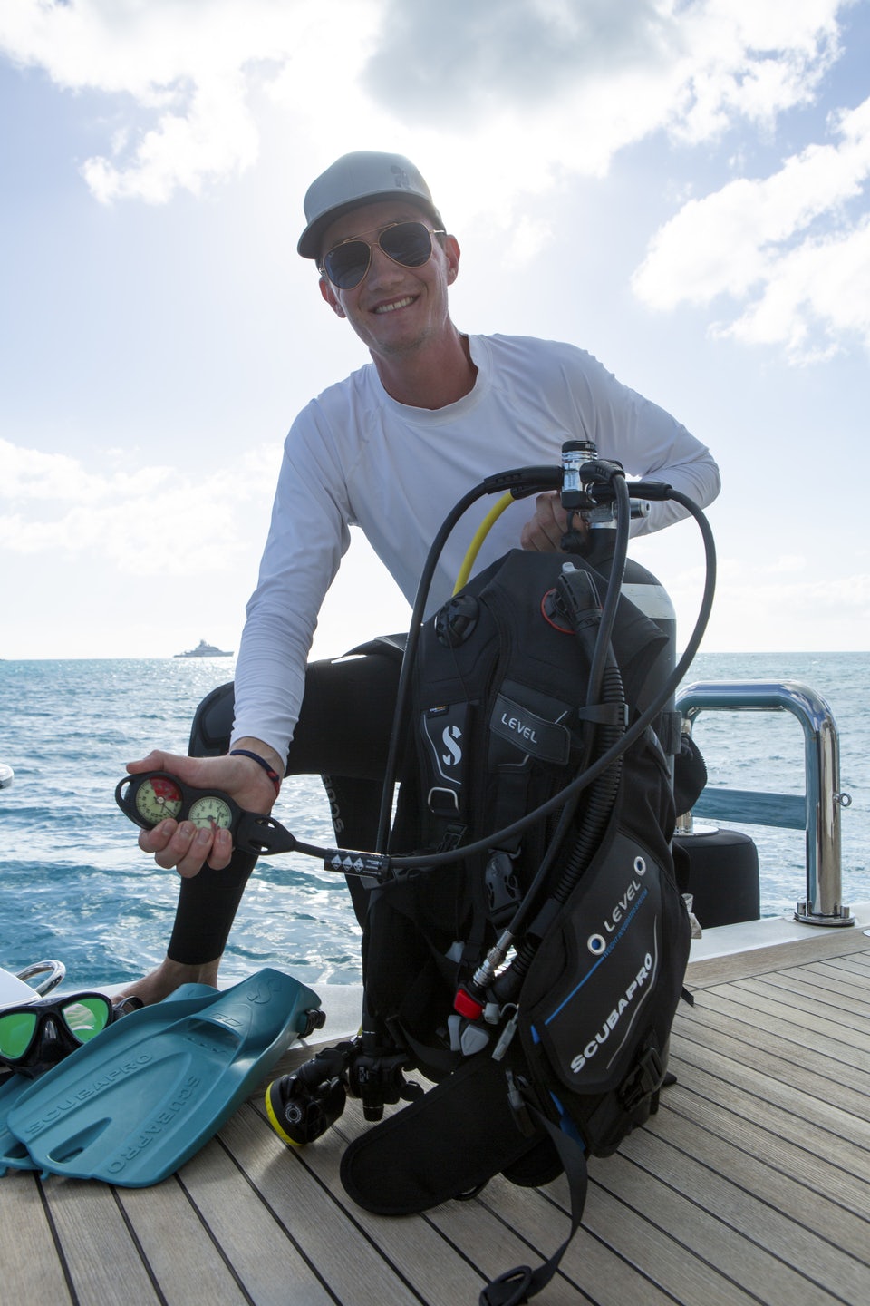 a person holding a fish on a boat aboard RIO Yacht for Charter