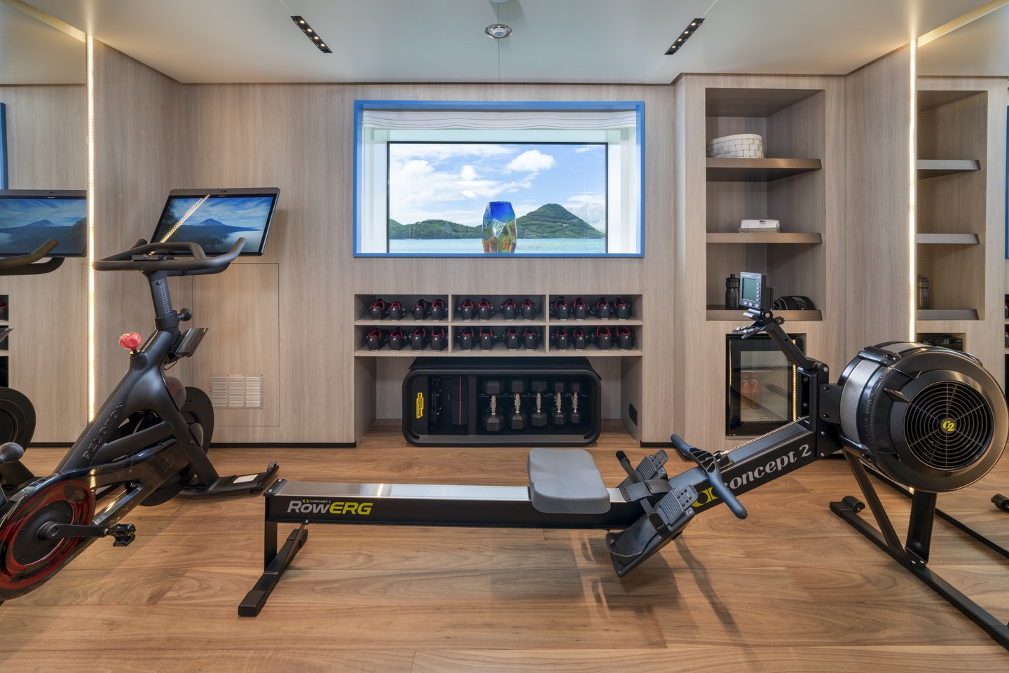 a room with a tv and a bicycle aboard RIO Yacht for Charter