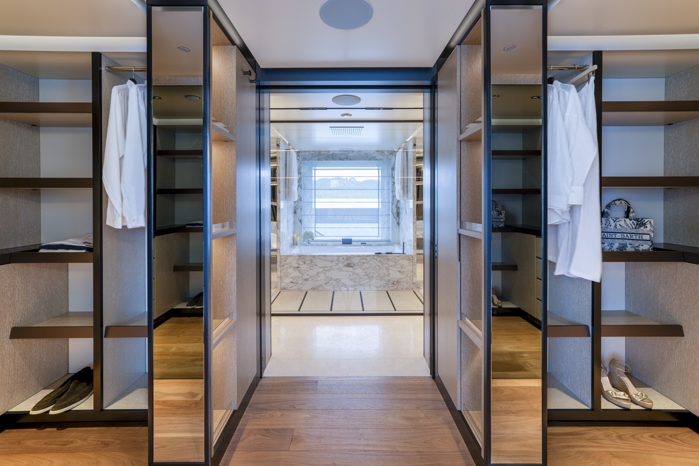 a room with a closet and shelves aboard RIO Yacht for Charter