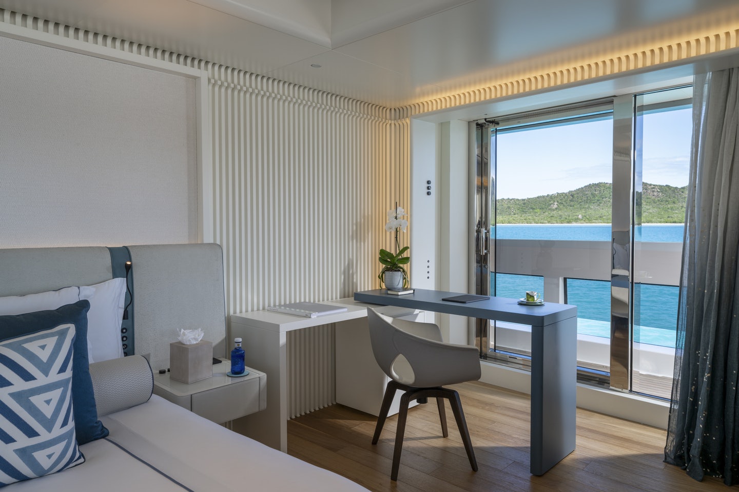 a room with a table and chairs aboard RIO Yacht for Charter