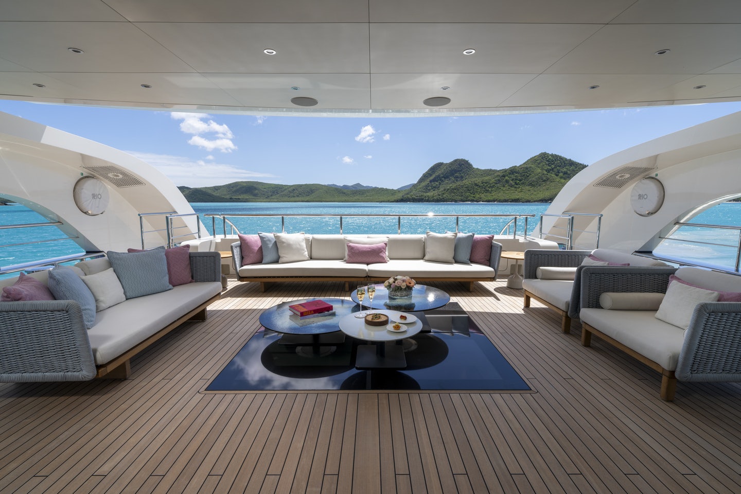 a living room with a large window aboard RIO Yacht for Charter