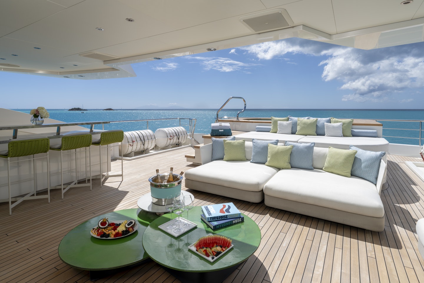 a room with a couch and a table with food on it aboard RIO Yacht for Charter