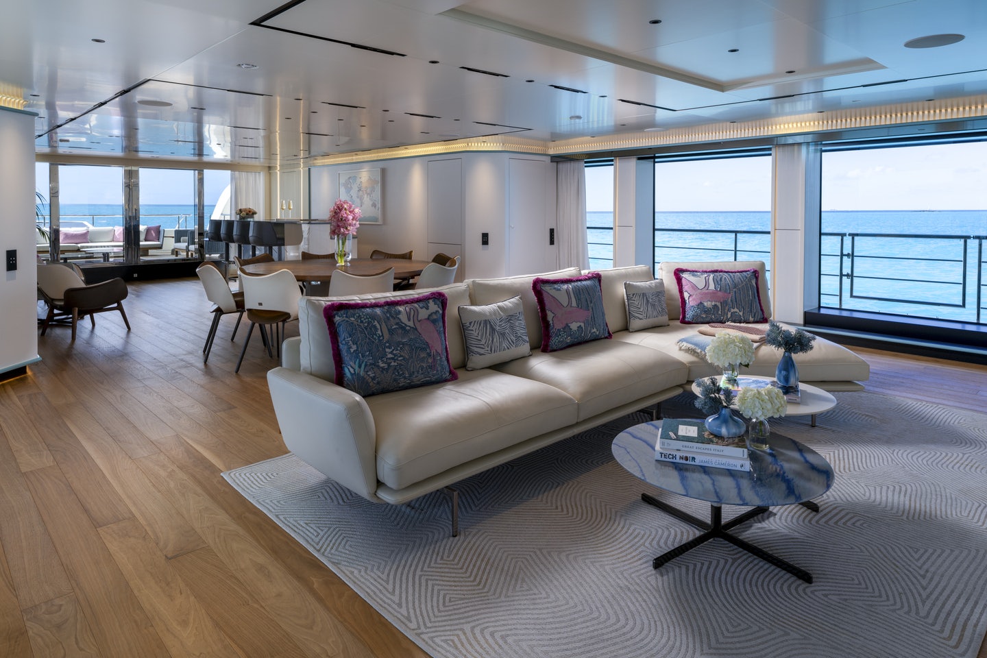 a living room with a couch and a table aboard RIO Yacht for Charter
