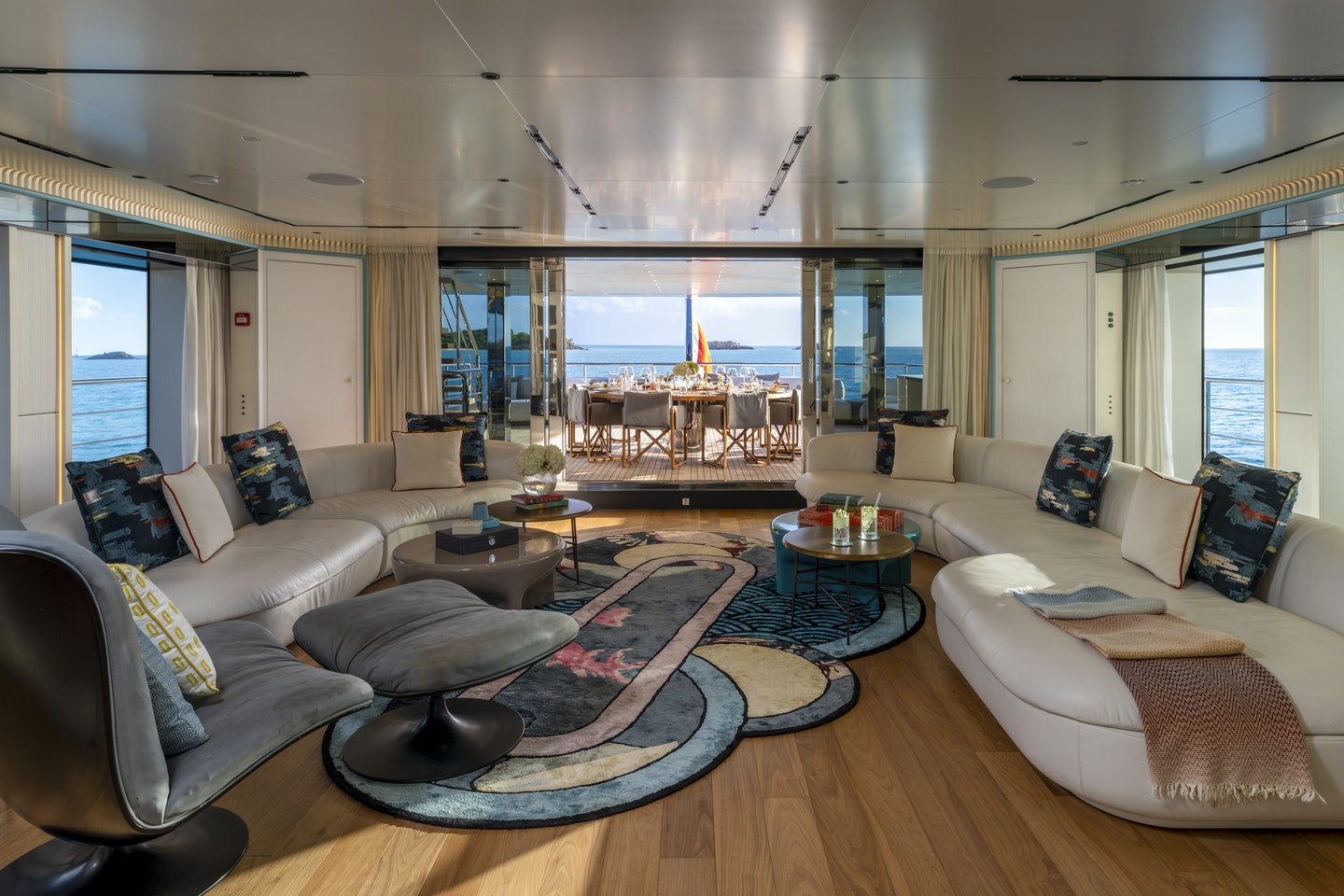 a living room with a large window aboard RIO Yacht for Charter