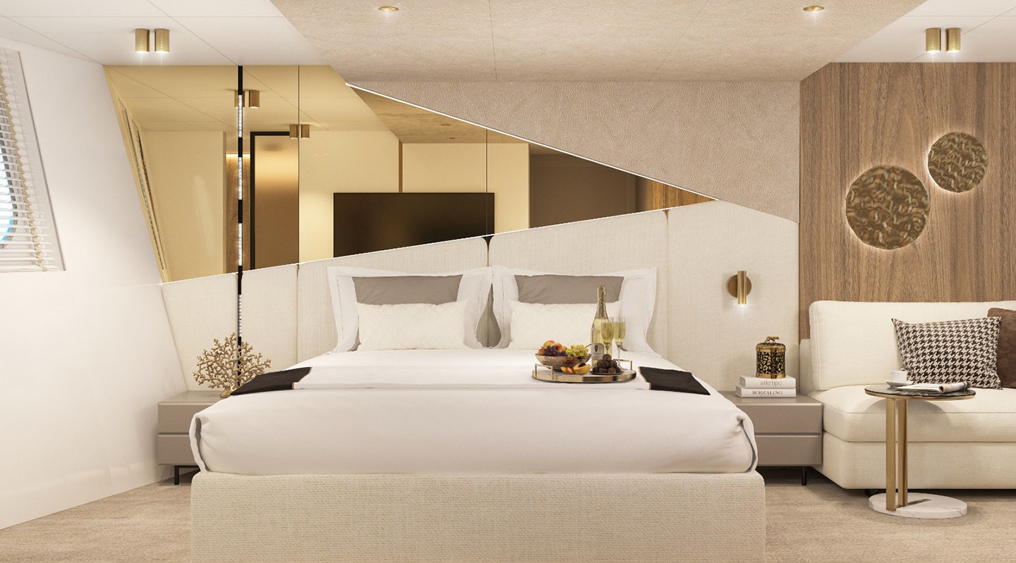 a room with a bed and a couch aboard CRISTAL Yacht for Charter