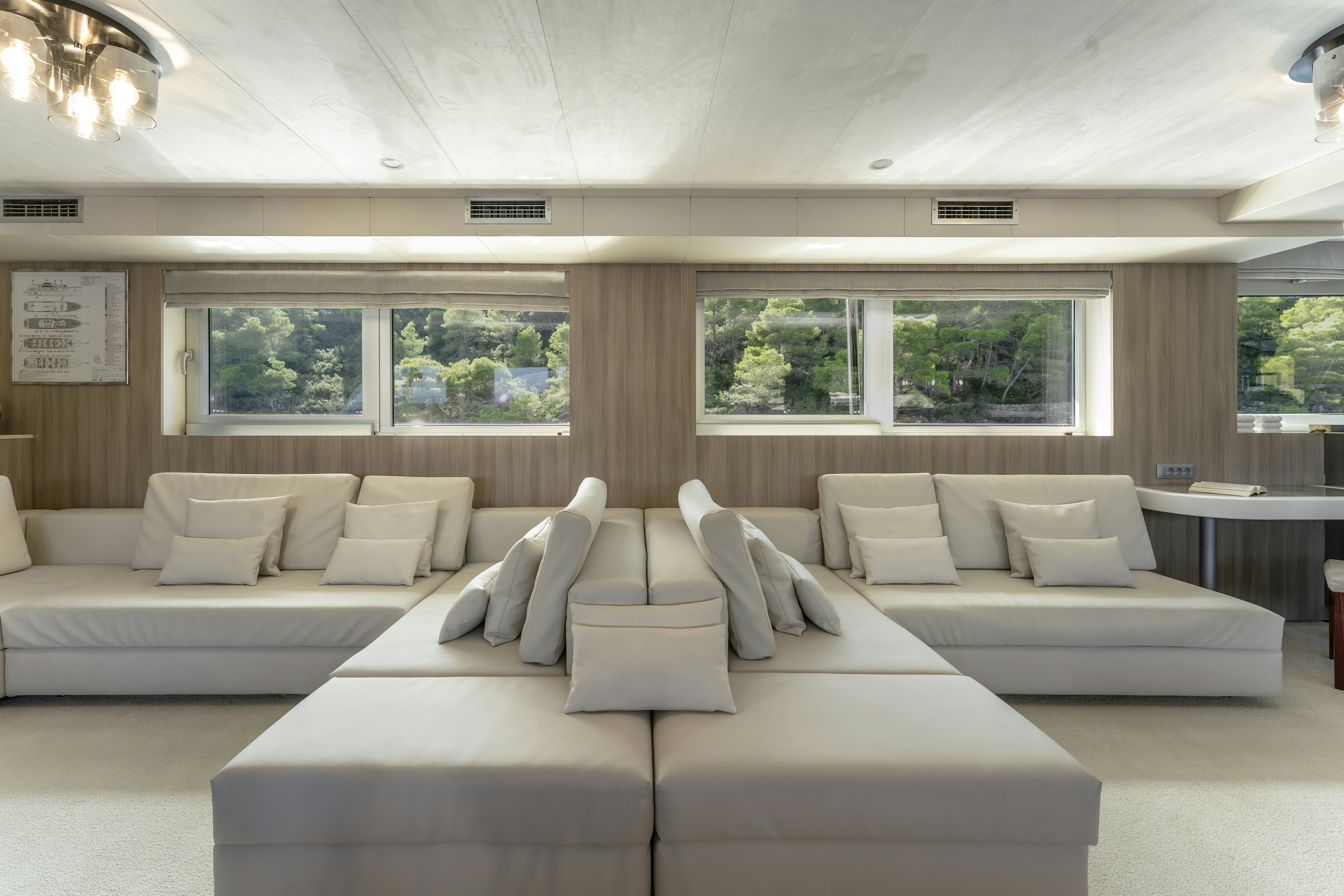 a living room with a couch and a table aboard CRISTAL Yacht for Charter