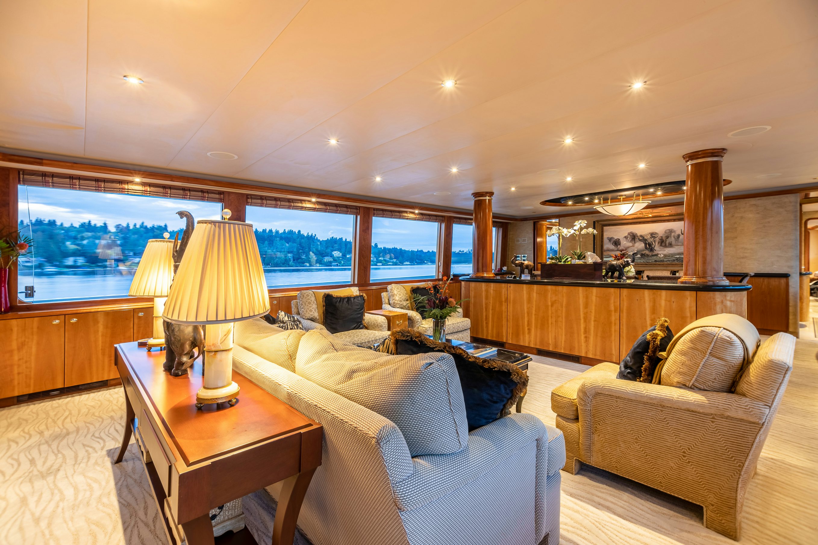 a living room with a couch and a table aboard SERENGETI Yacht for Charter